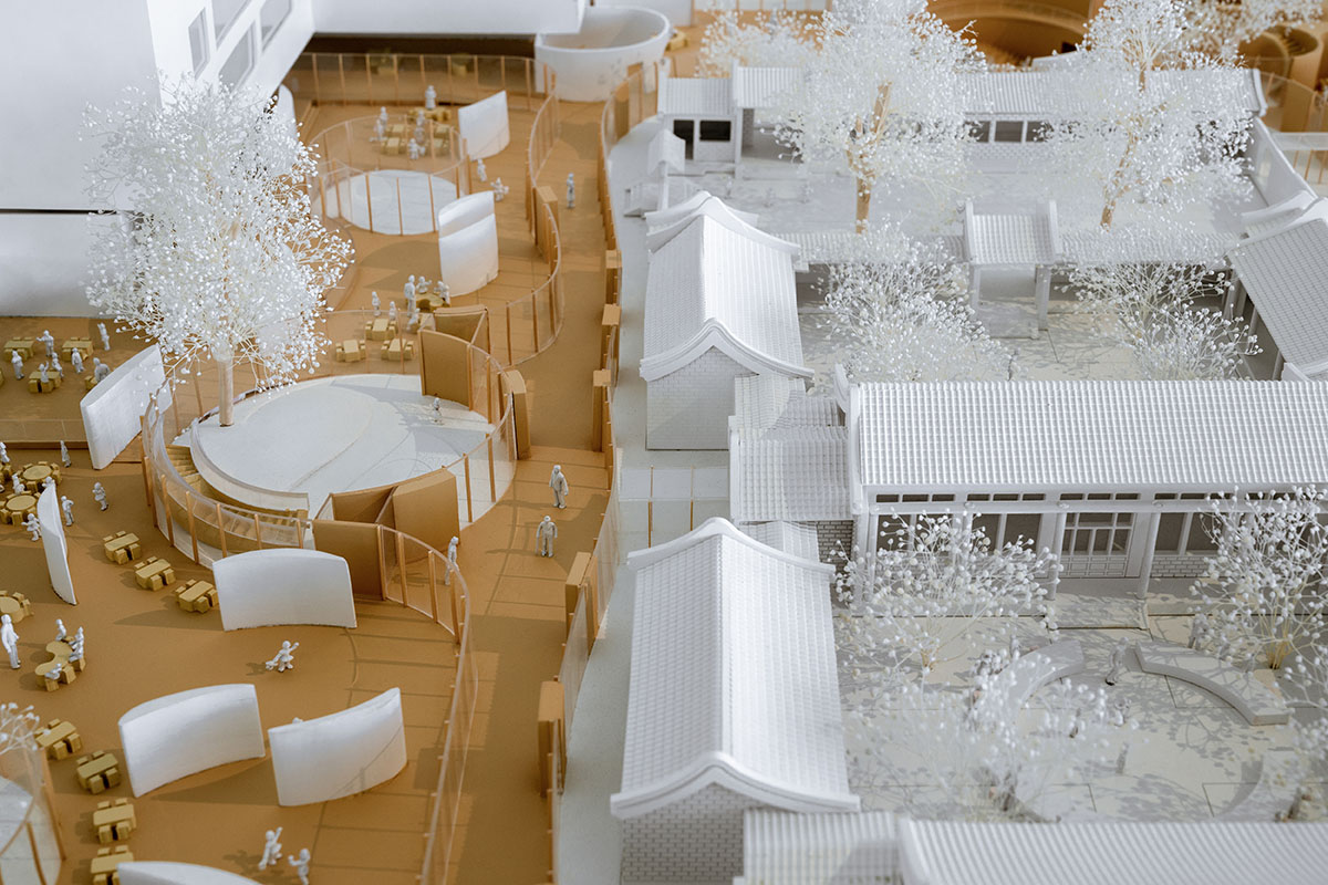 MAD's kindergarten features porous floating roof that surrounds the historic courtyard in Beijing