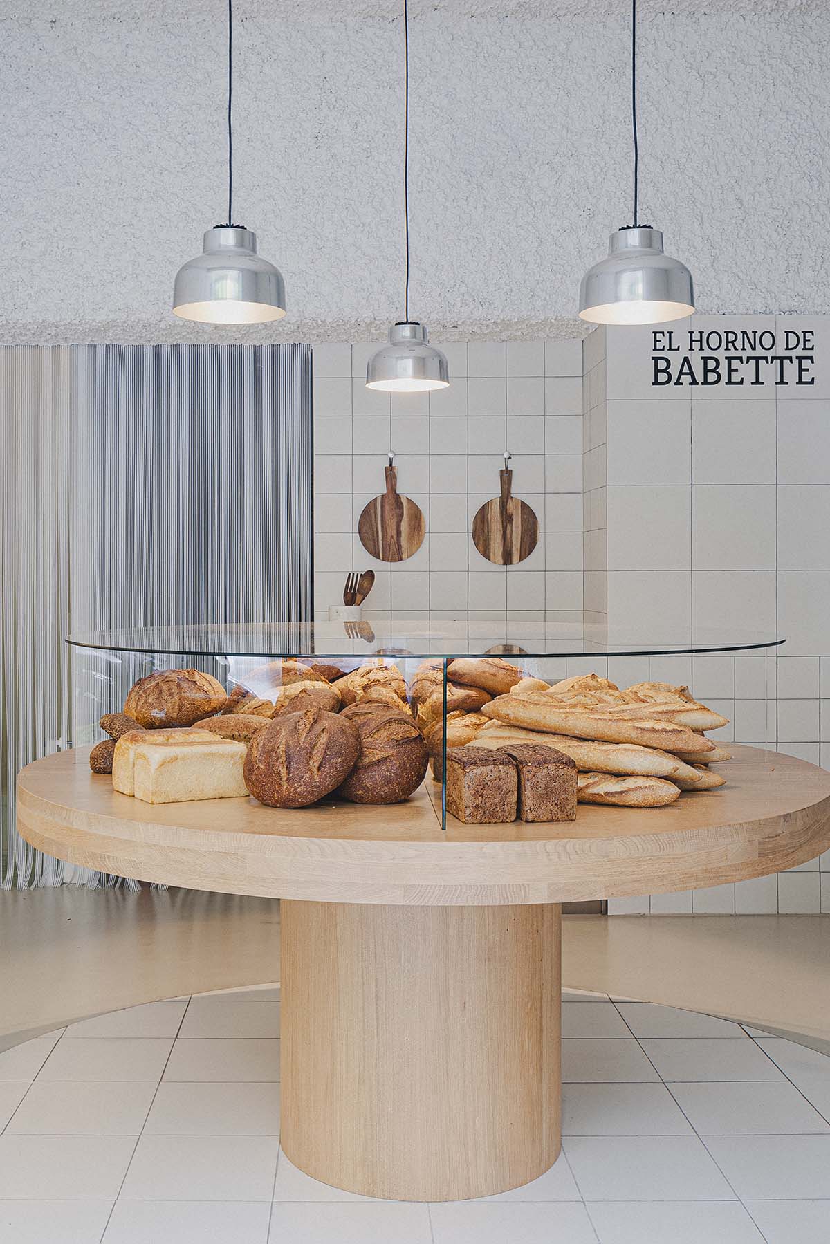 Bakery features central oak tables that revive the traditional dining room experience 