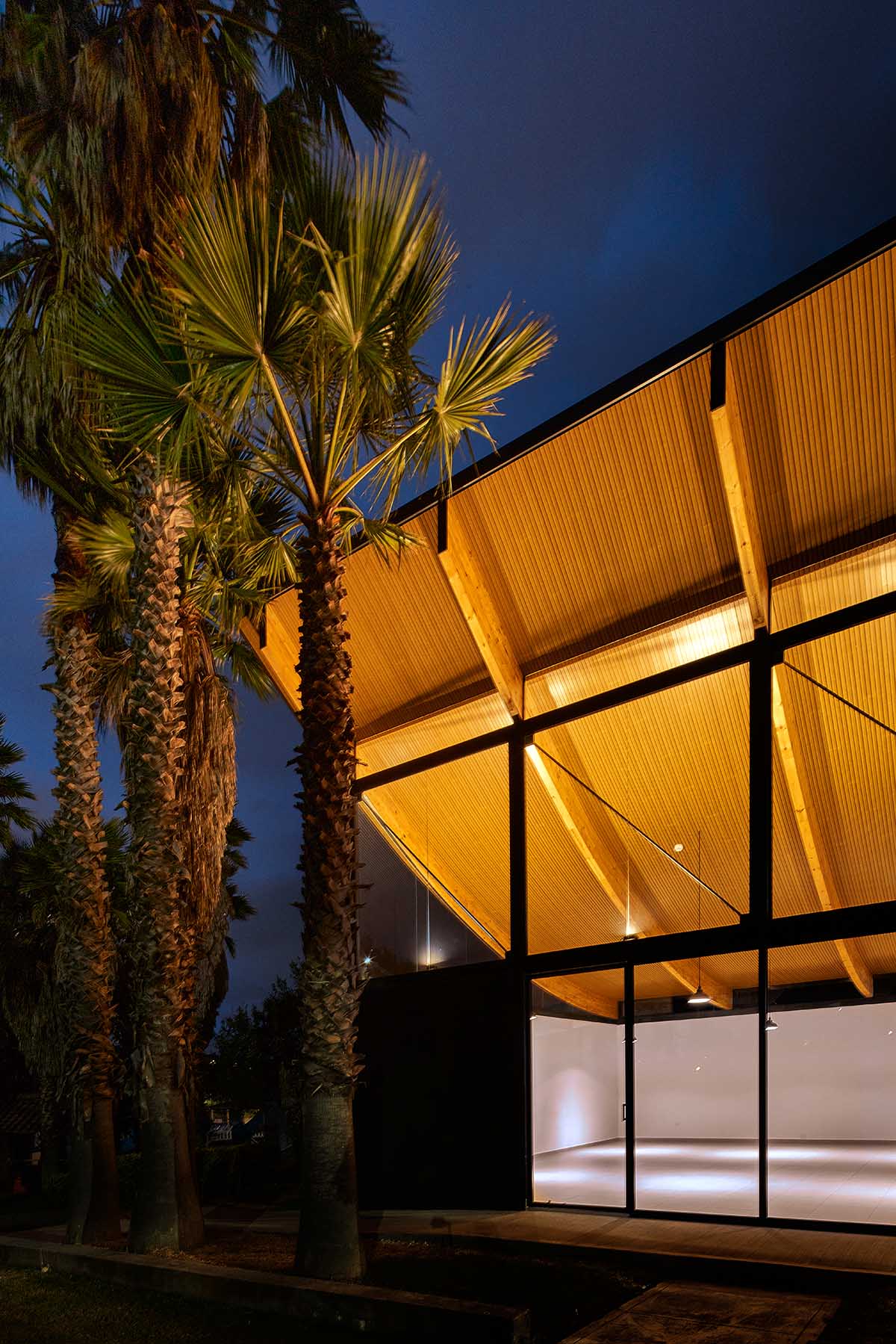 TEC Taller EC creates pavilion with concave wooden roof that becomes a façade in Ecuador