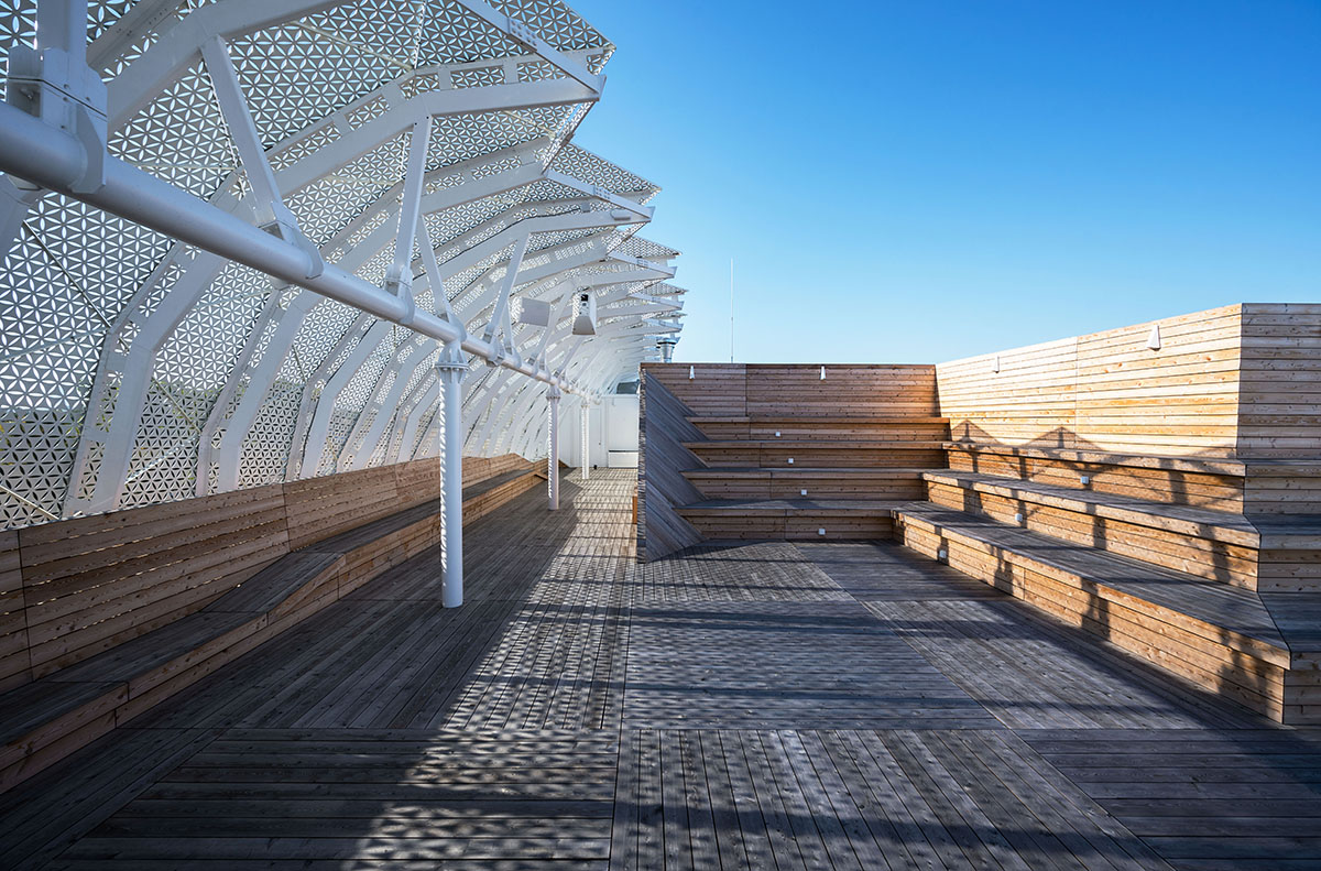 FAAB wraps research center with white perforated facade evoking sea waves in Poland 
