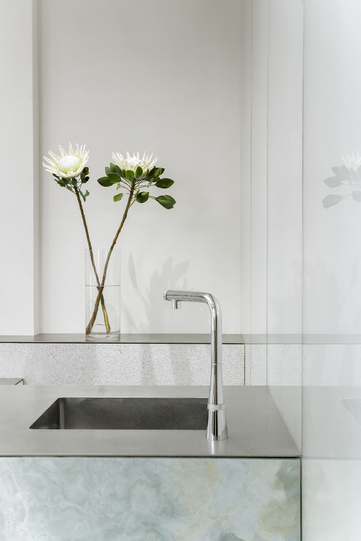 More Design Office's Absolute Flower Shop features cellular spaces with flower arrangements