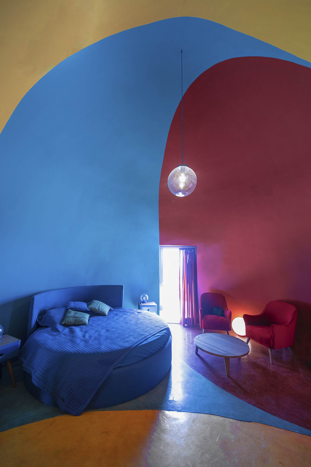 ZAV Architects built colorful-domed housing made of rammed earth and sand on Hormuz island, Iran