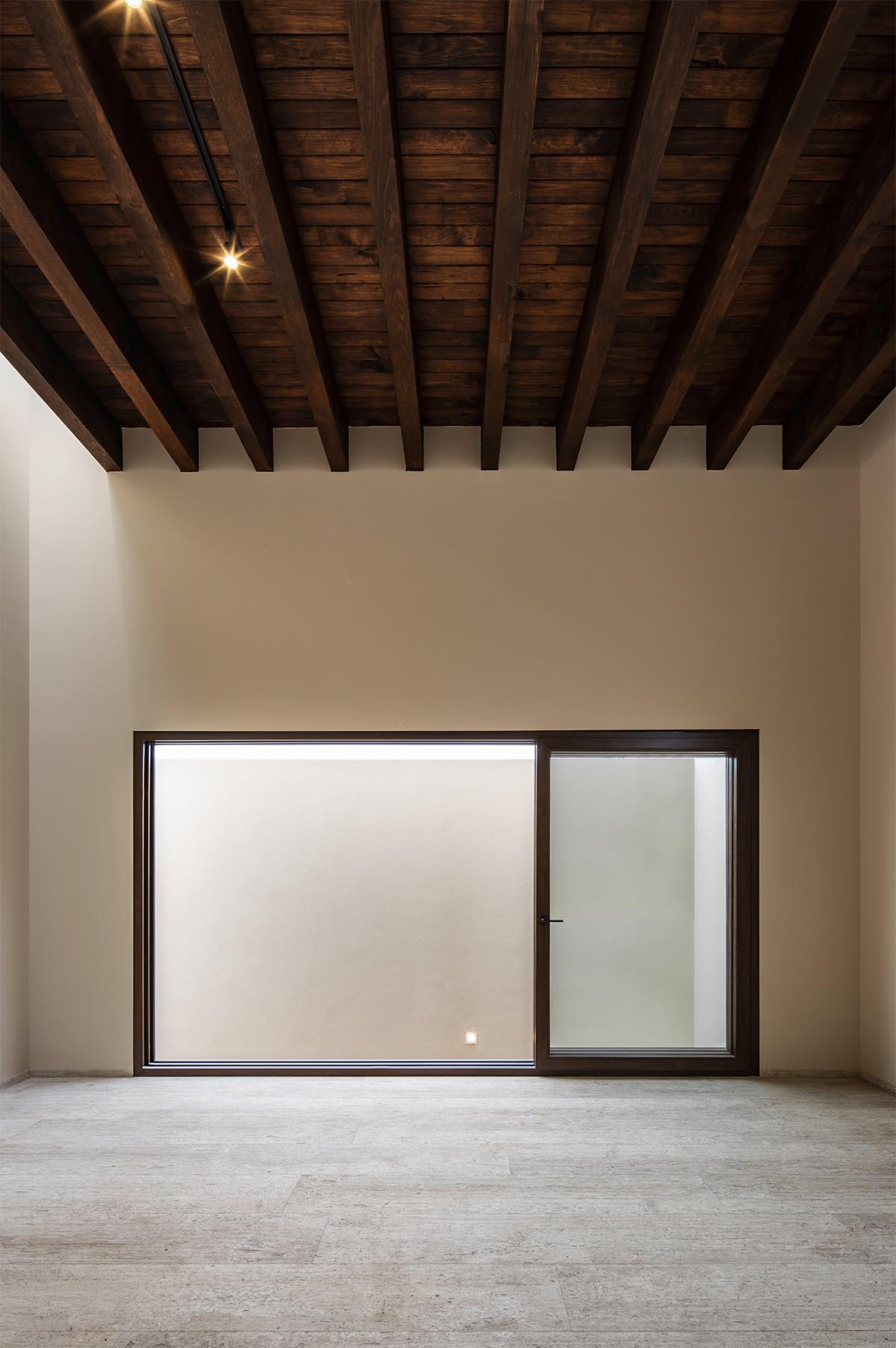 Sabino 10 residence by Editorial features a solid façade with hermetic volumes in Mexico