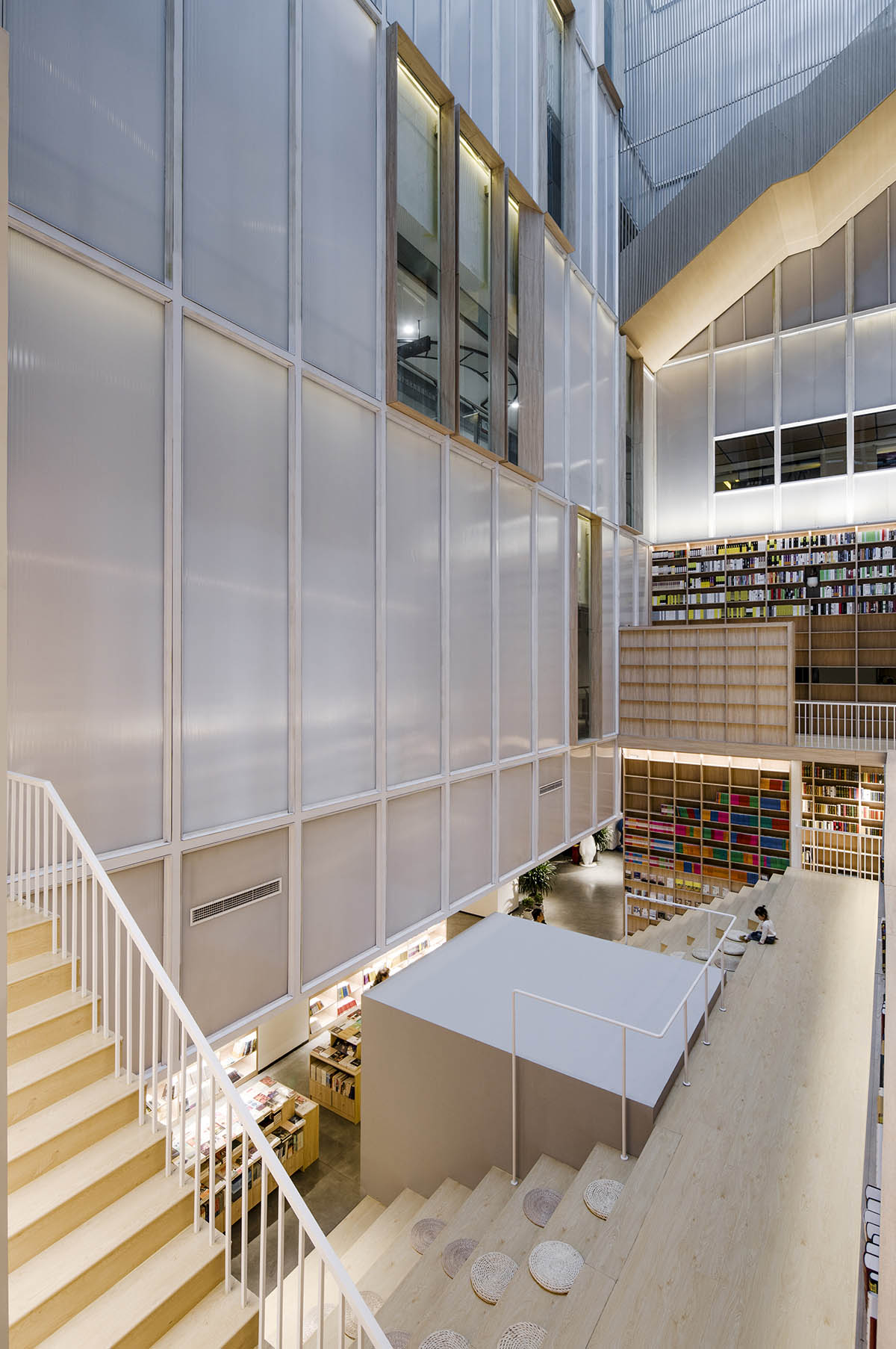 y.ad studio designs Yuanping Meijing Bookstore hidden in daylighting atriums in China