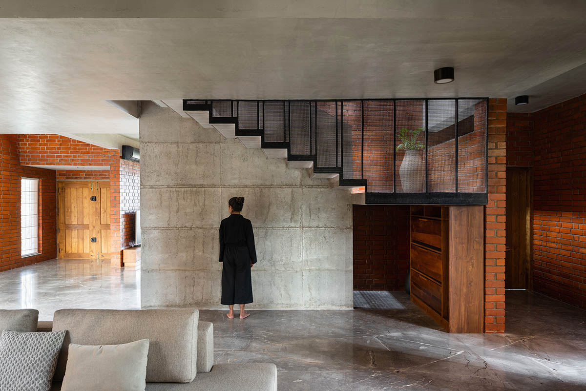 Srijit Srinivas - ARCHITECTS built brick family house with angled triangular façade in Kerala