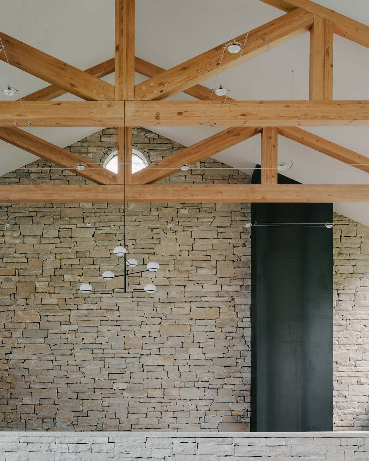 The stone and wood Tbilisi residence integrates architecture with the natural landscape