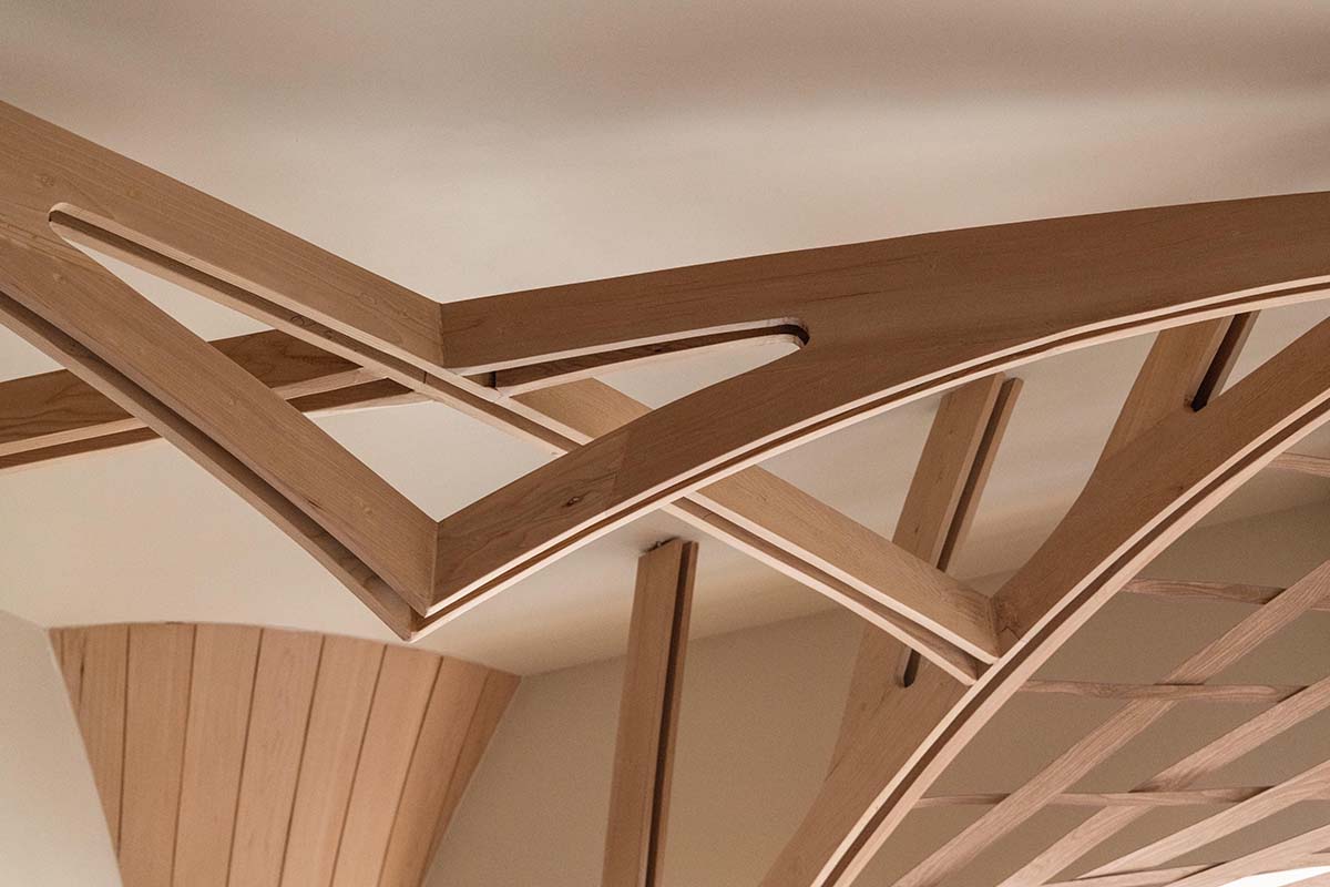 studio Hinge embeds a library under the wooden tree-like canopies in Mumbai