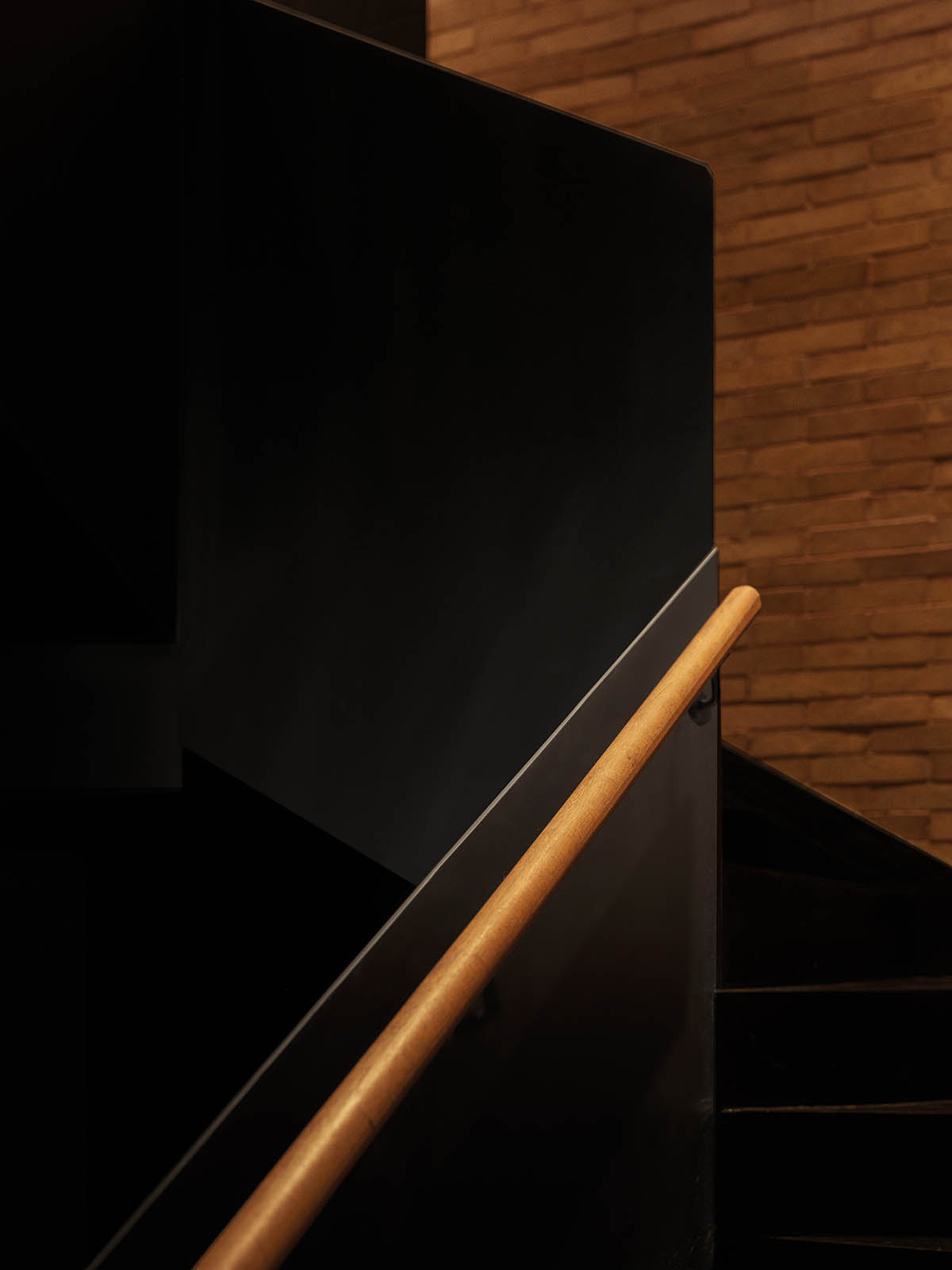 Large triple-arched windows enhance the iconic presence of the concrete Whisky Bar in Taiyuan, China