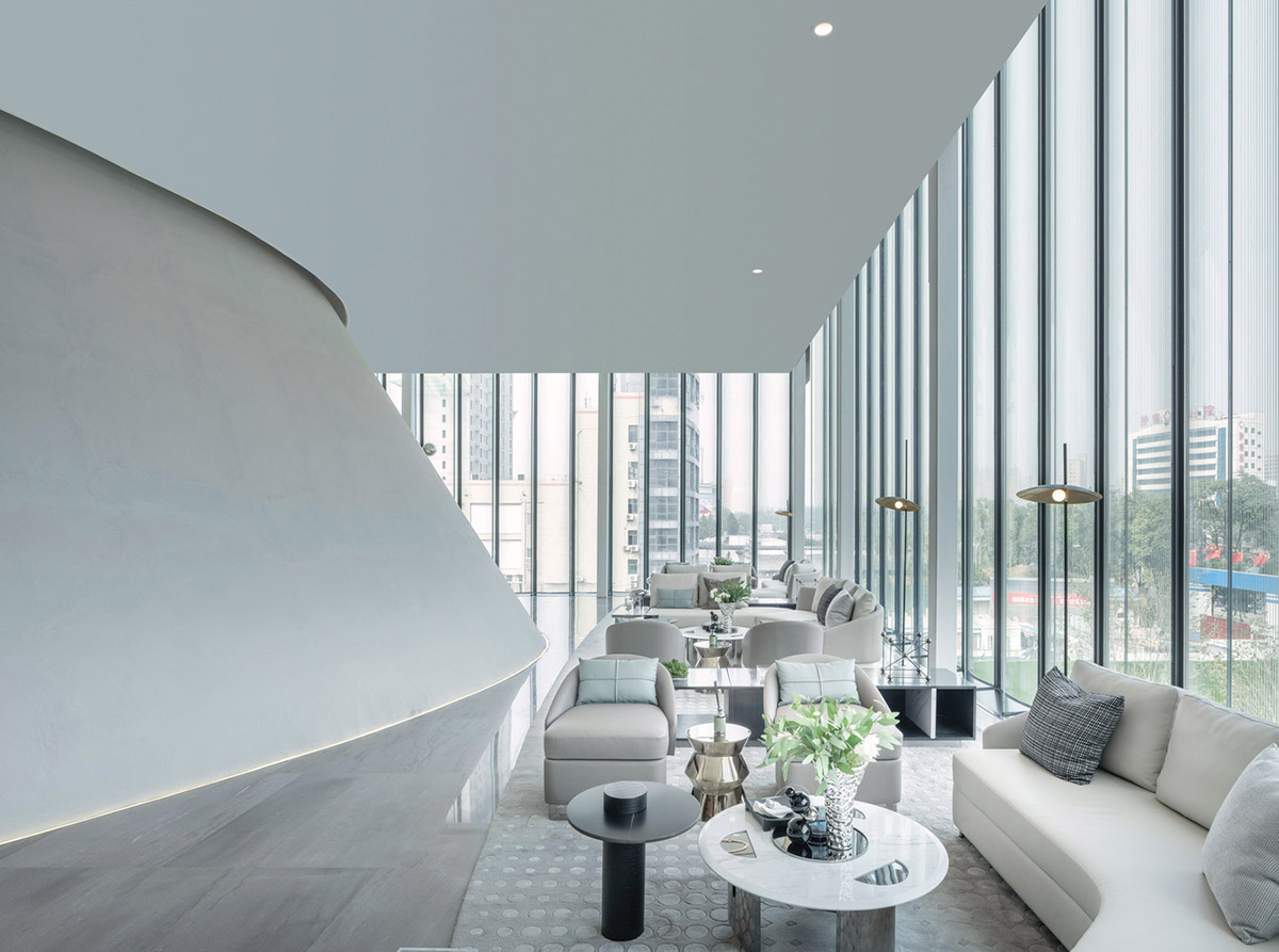 Community Center in Xi’an is raised on sculptural base that features a rippling effect