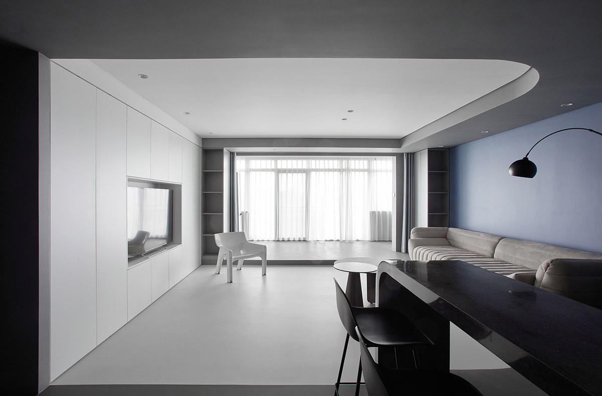 XIGO STUDIO creates gray and blue-colored interiors for apartment in Beijing 