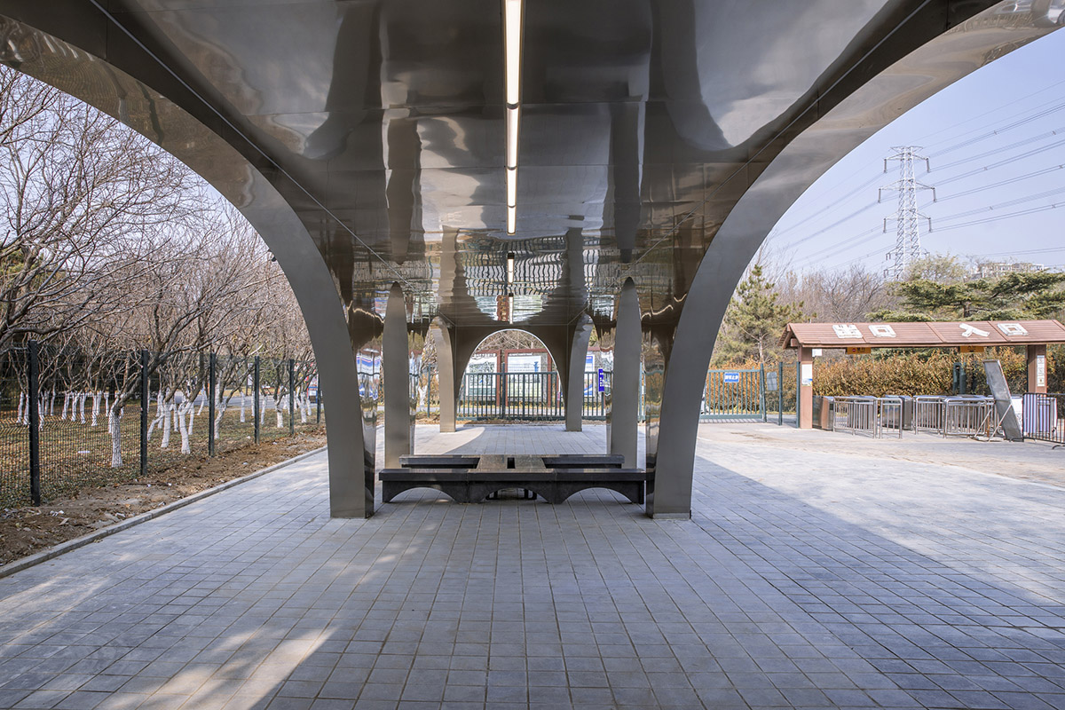 TEMP designs runner's station with stainless steel arcades in Beijing Olympic Forest Park