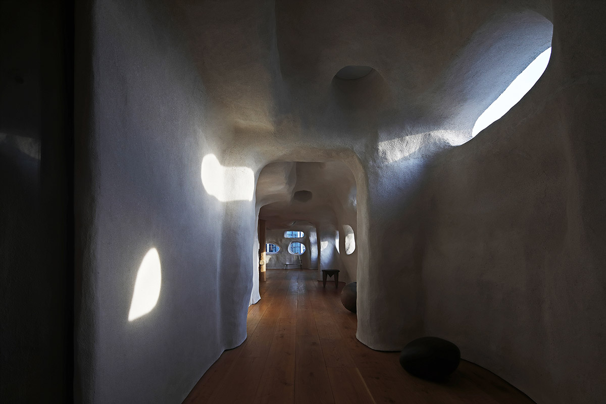 Pilates studio by Wanmu Shazi creates cave-like experience with amorphous interiors in Xiamen