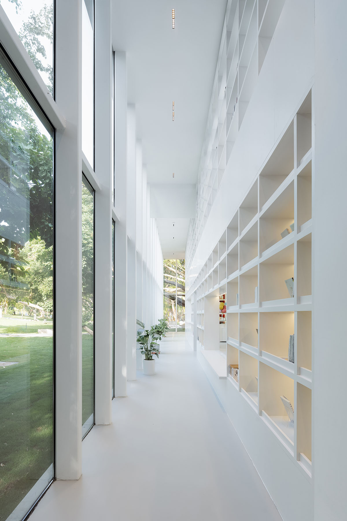 Wutopia Lab elaborates bookstore with red triangular bookshelves for Tianya Books in China 