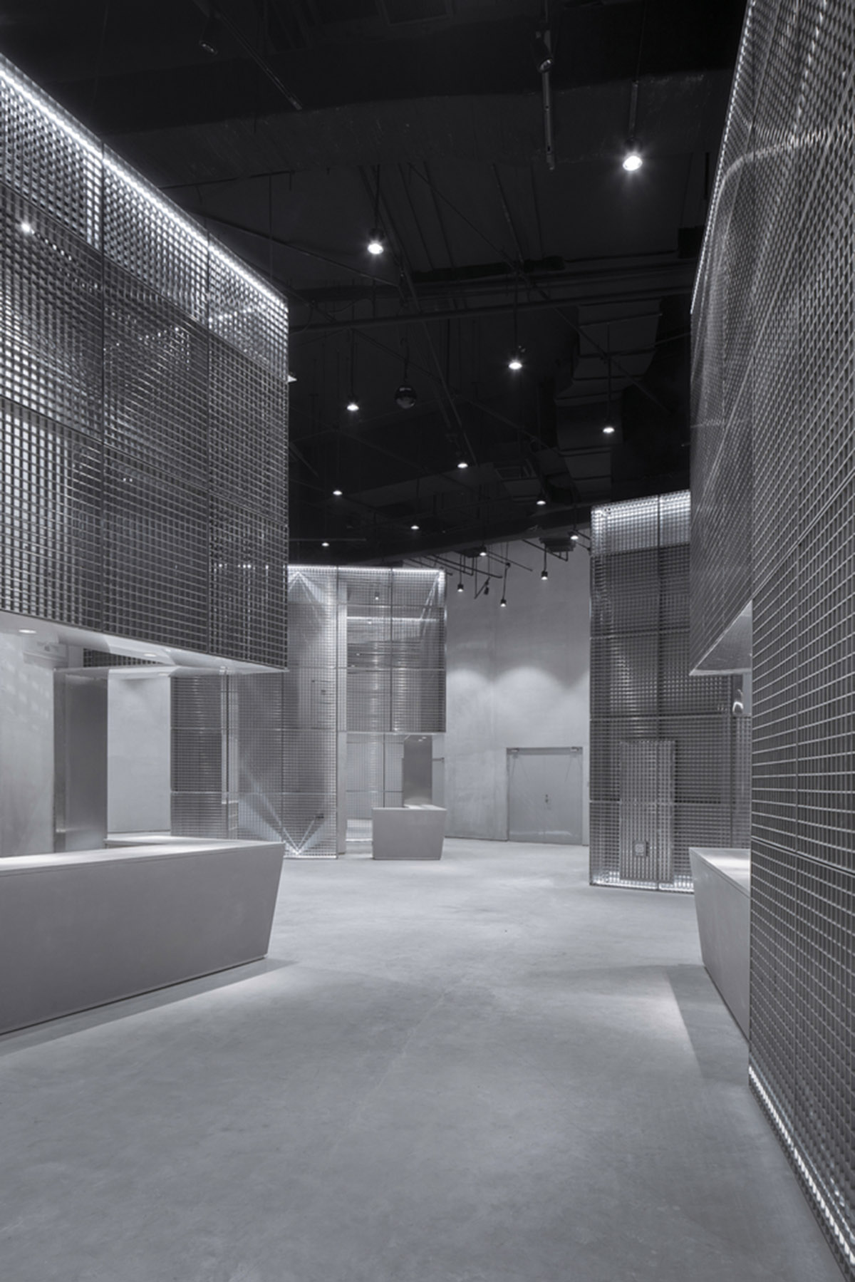 BANDe Architects combines greyscale interior with gridded wooden structures for GreenMonster Lab