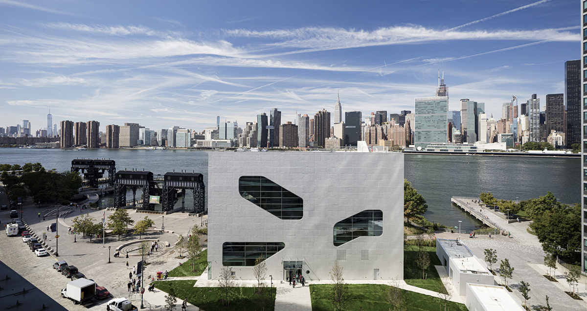 Steven Holl Architects completes Hunters Point Library with flowing sculpted cuts in New York