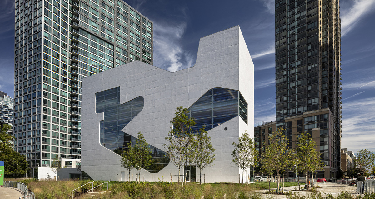 Steven Holl Architects completes Hunters Point Library with flowing sculpted cuts in New York