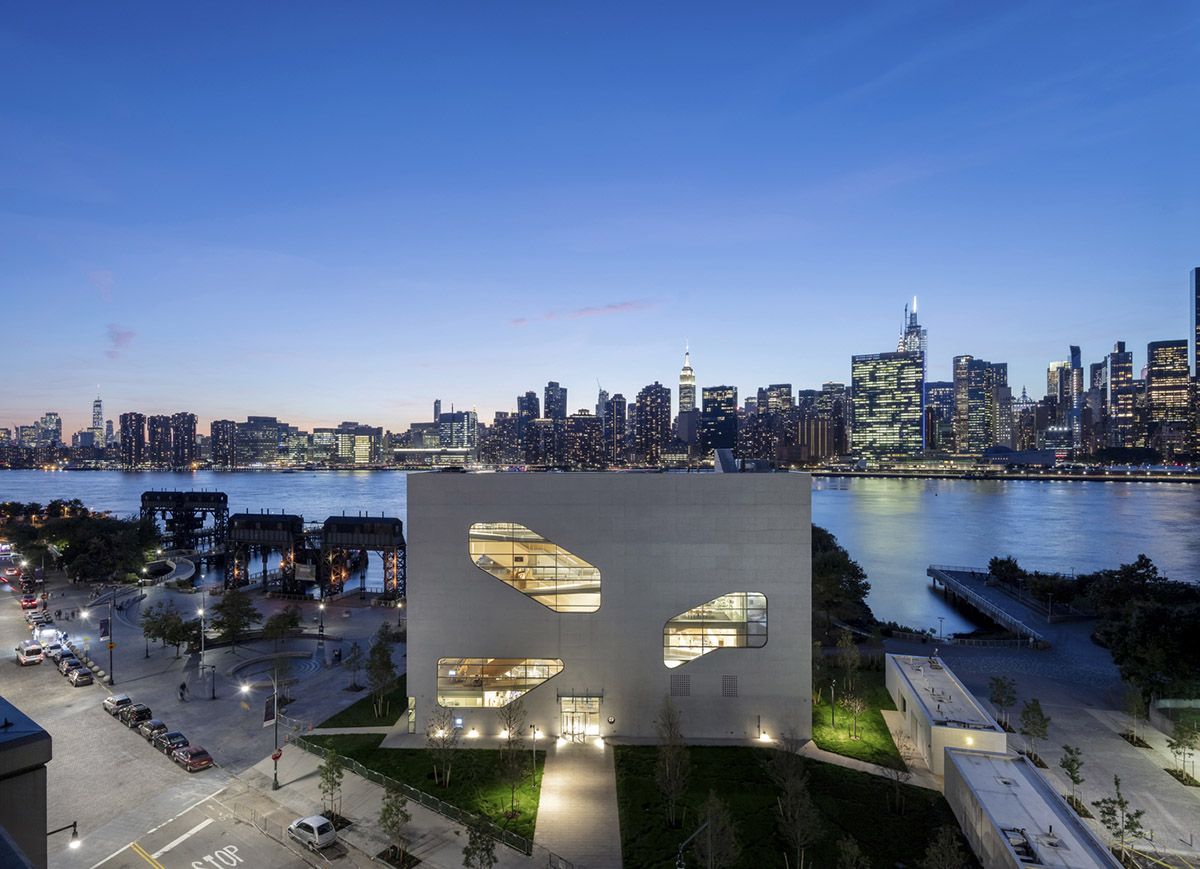 Steven Holl Architects completes Hunters Point Library with flowing sculpted cuts in New York