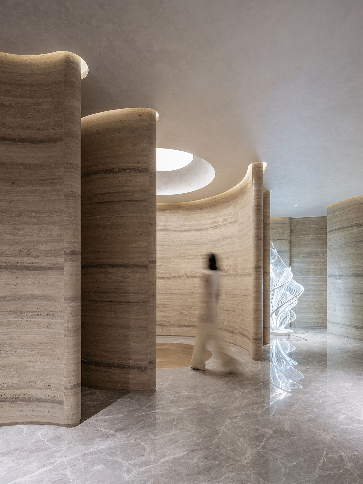 Undulating lines and expansive waves define interior of Orbit public exhibition hall in Shanghai 