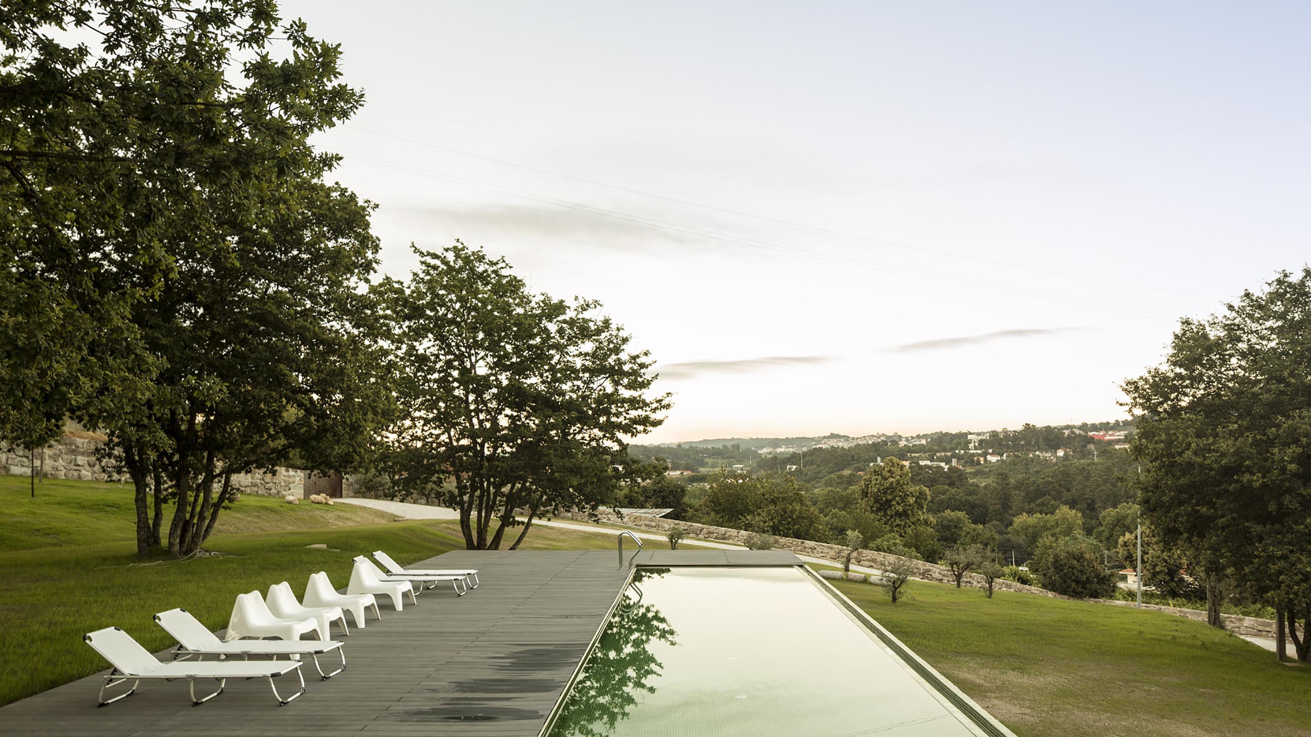 An elongated Sambade house by Spaceworkers presents itself as sober urban landmark in Portugal