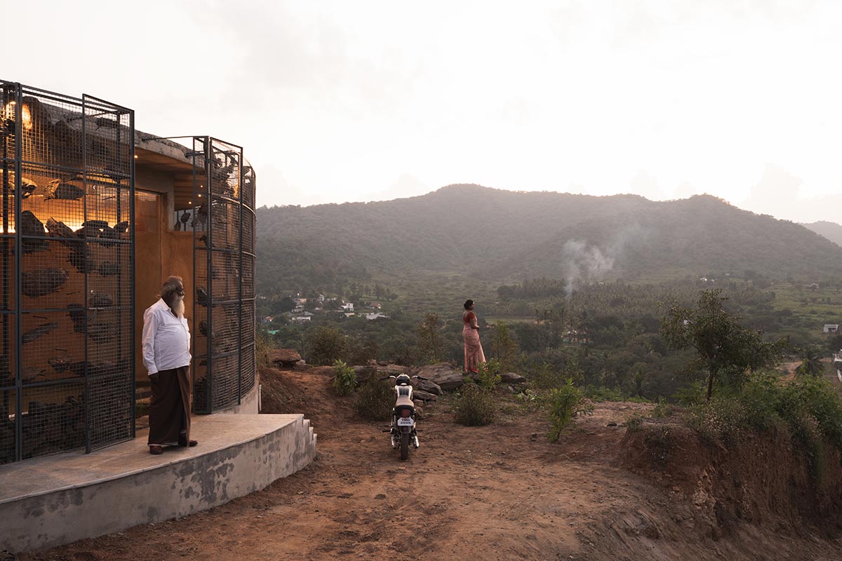 Farm house by Earthscape Studio is wrapped by gabion wall to filter light and airflow in India 