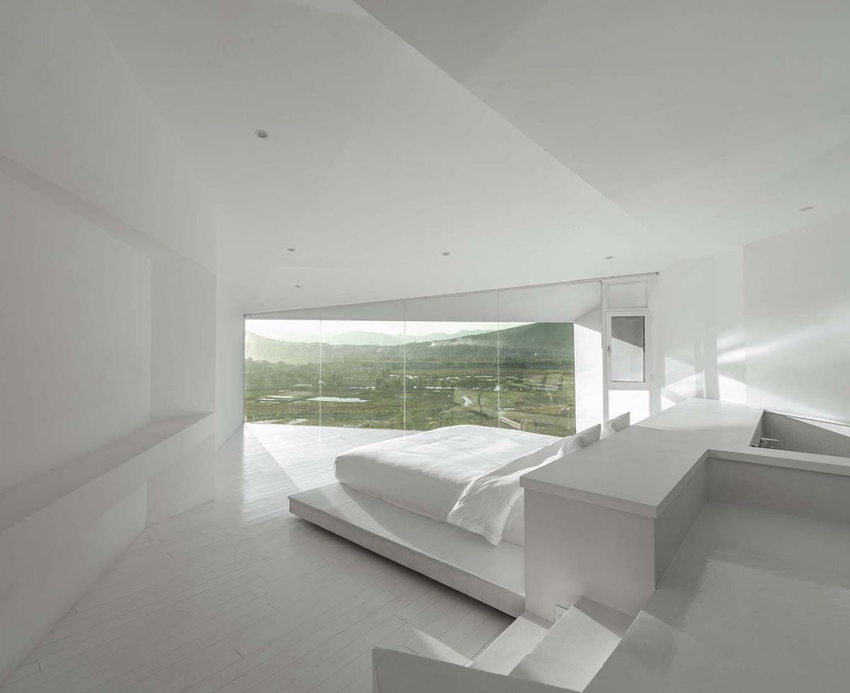 STUDIO QI reinterprets sequence of living conditions with tilted hotel on a hilly plot in China