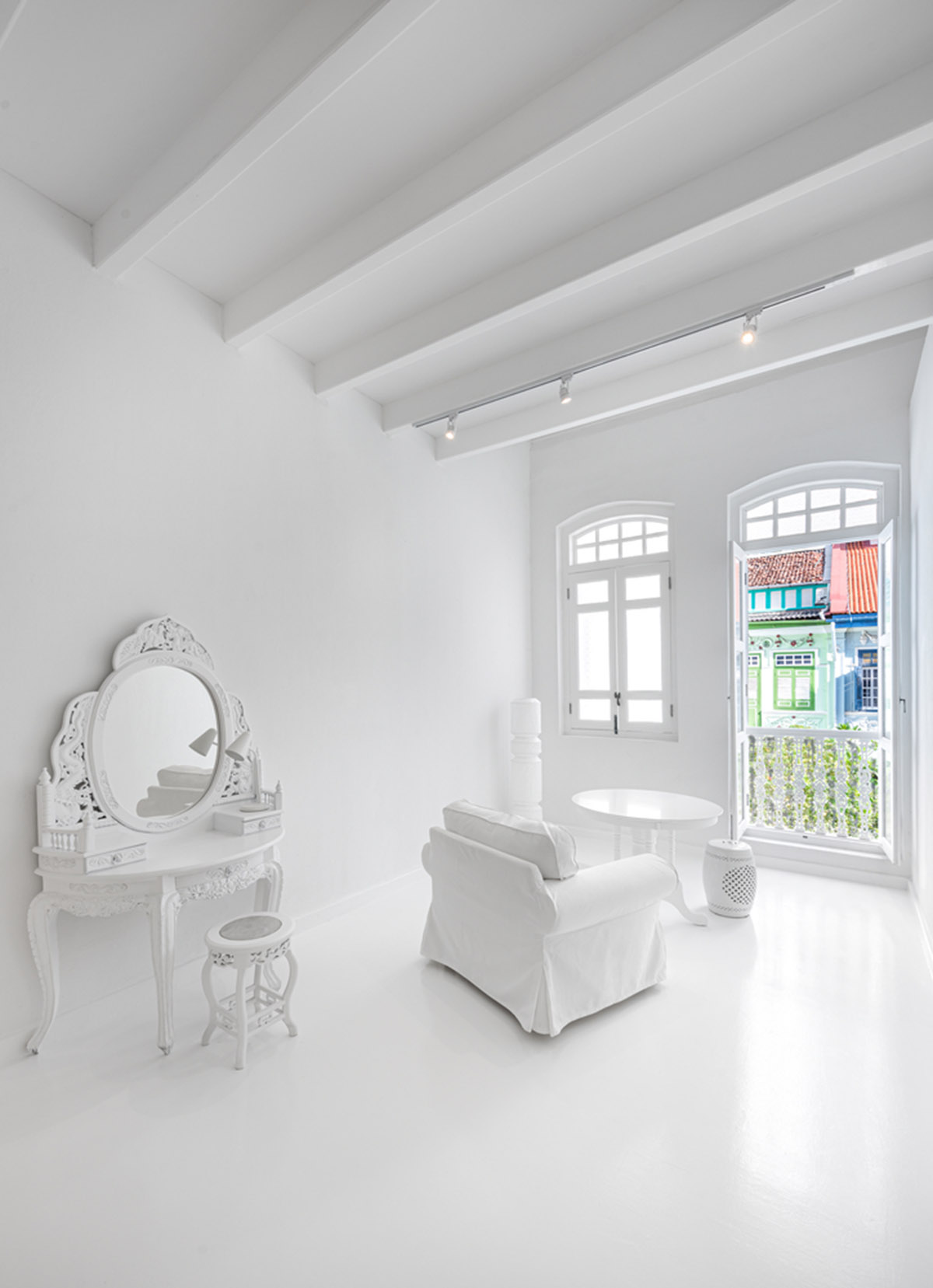 Ministry of Design transforms old dwelling in Singapore into co-living house with all-white interiors