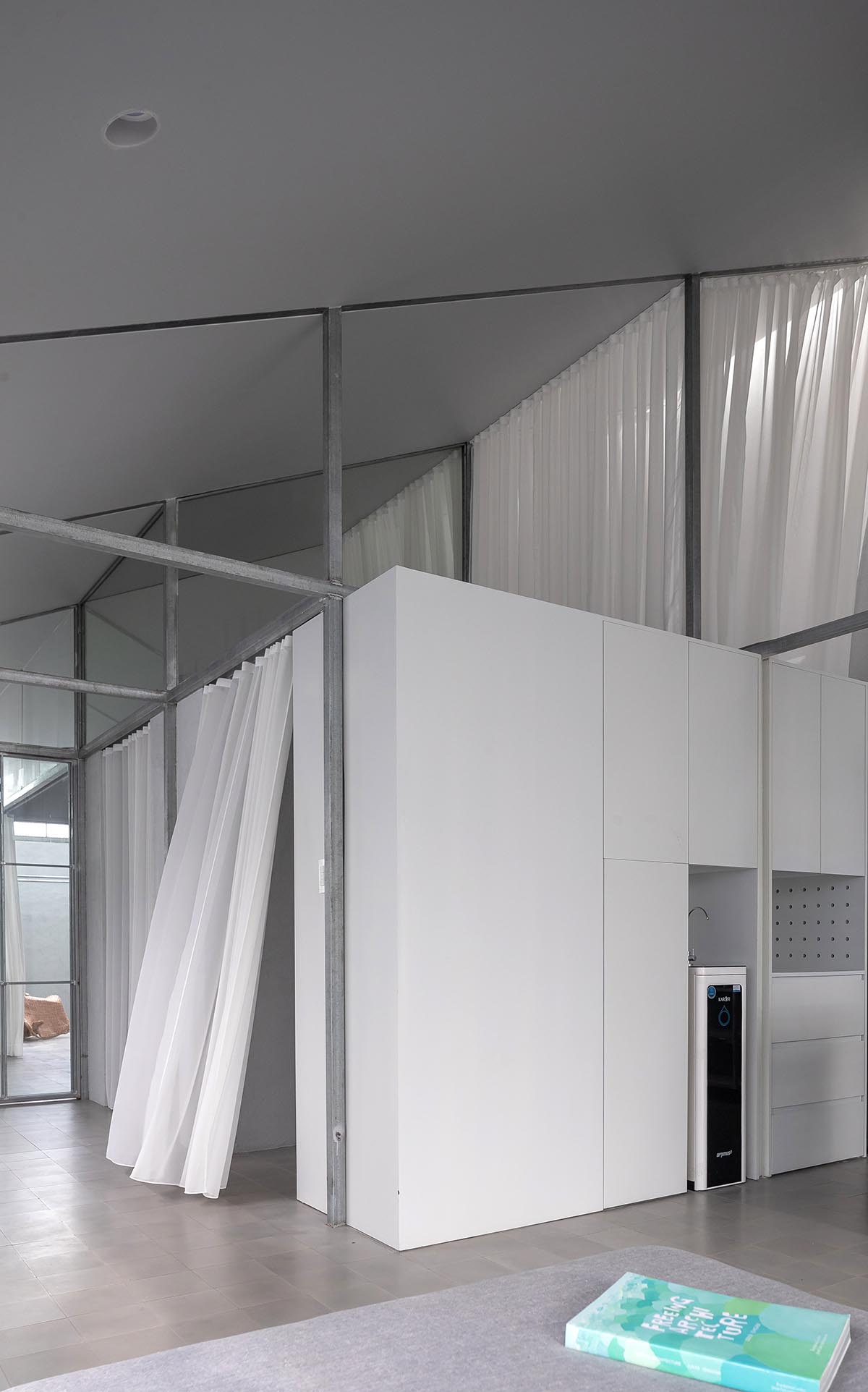 MIA Design Studio completes family house with angular roof in Vietnam 