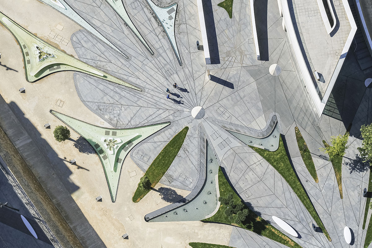 Zaha Hadid Architects designs urban park informed by fluid geometries opening the city's dry moat