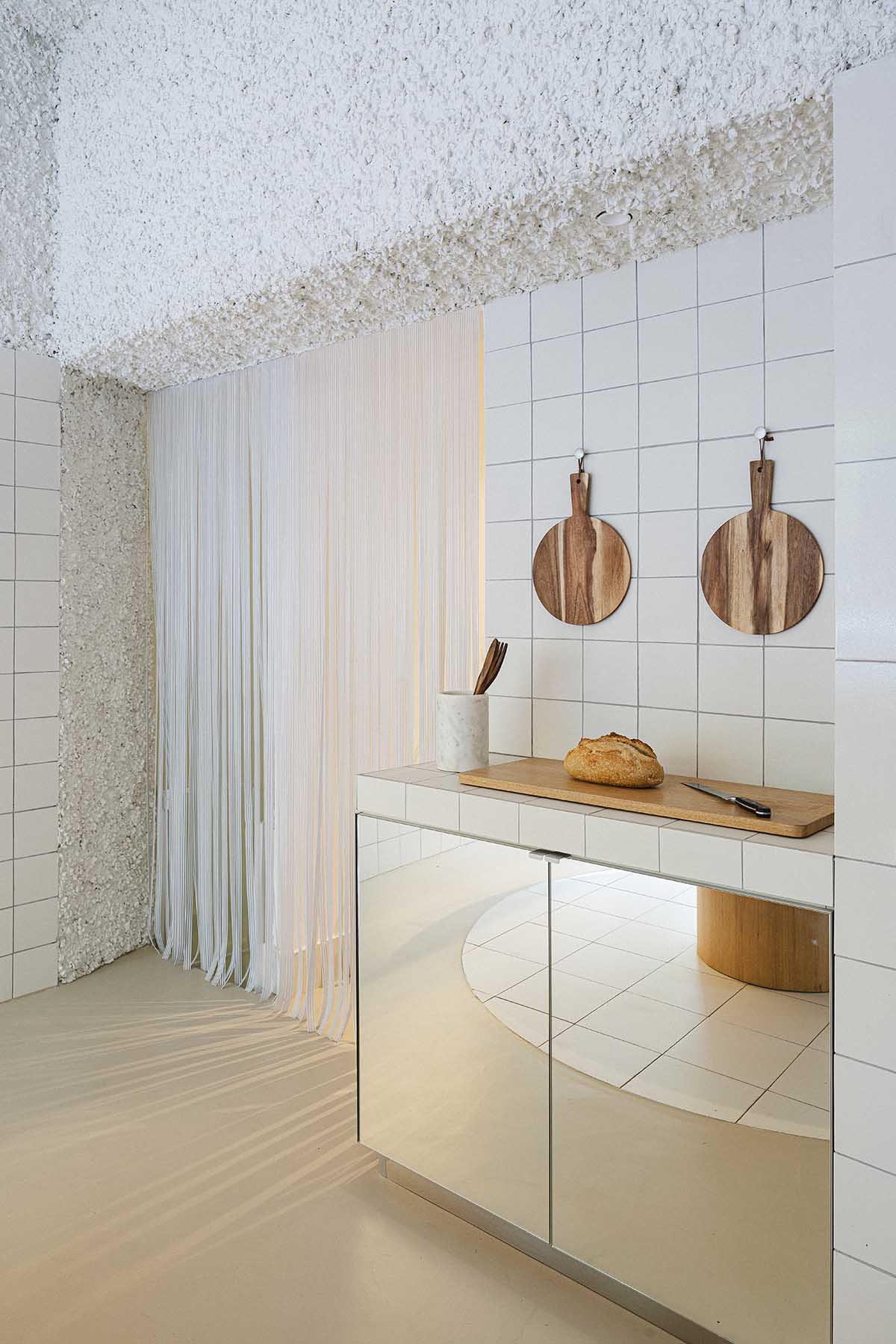 Bakery features central oak tables that revive the traditional dining room experience 