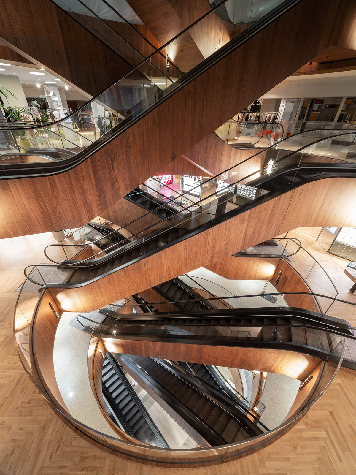 OMA completes KaDeWe Department Store in Berlin with a sculptural wooden escalator