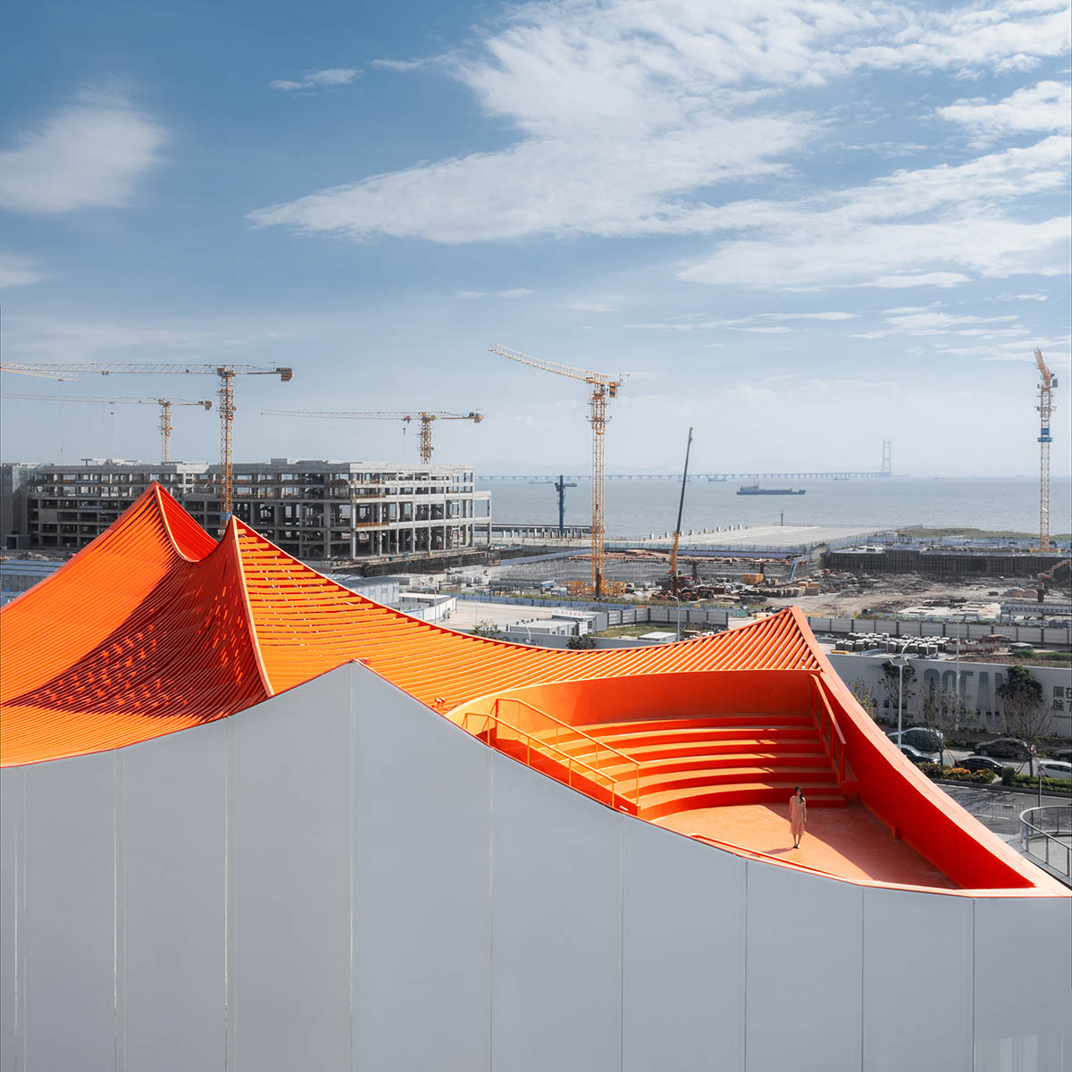 Wutopia Lab built showroom evoking Chinese red mountains with dazzling orange-colored roof