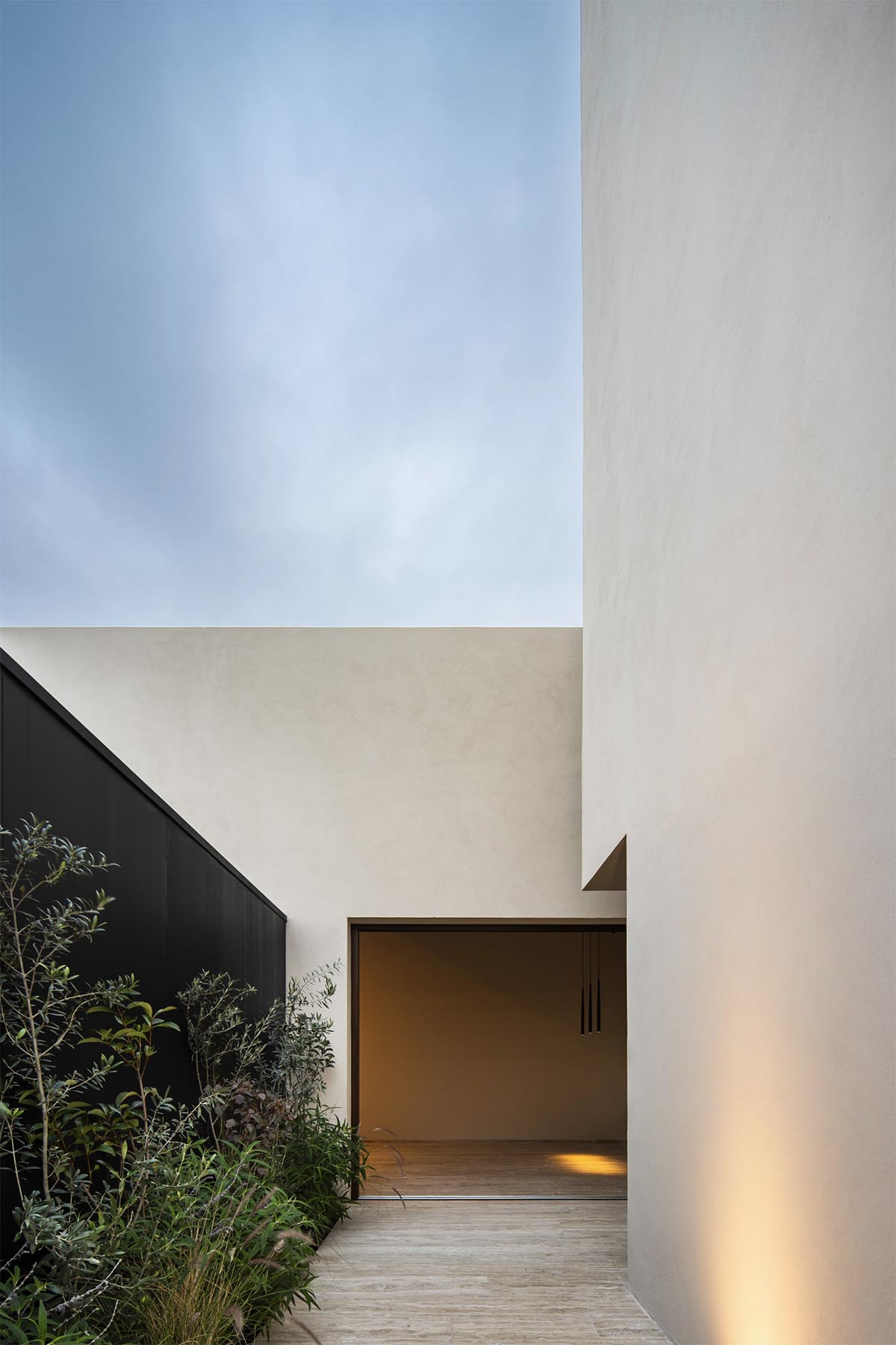Sabino 10 residence by Editorial features a solid façade with hermetic volumes in Mexico