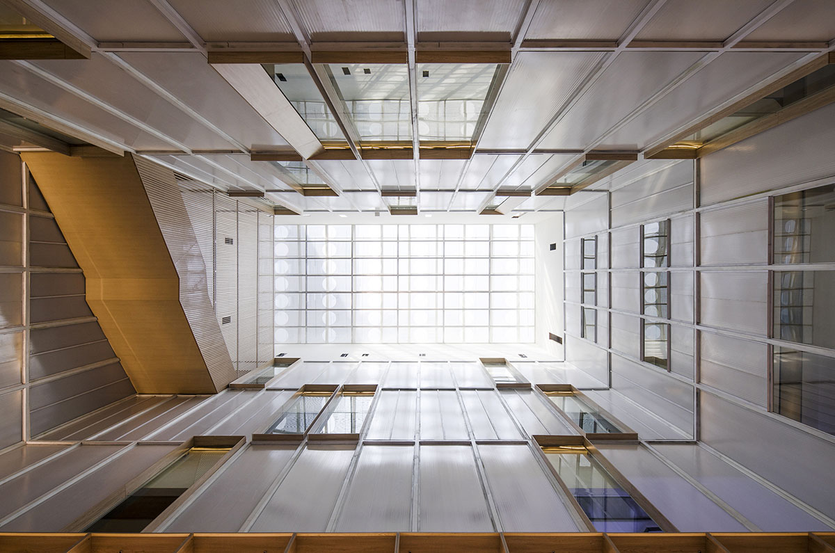 y.ad studio designs Yuanping Meijing Bookstore hidden in daylighting atriums in China