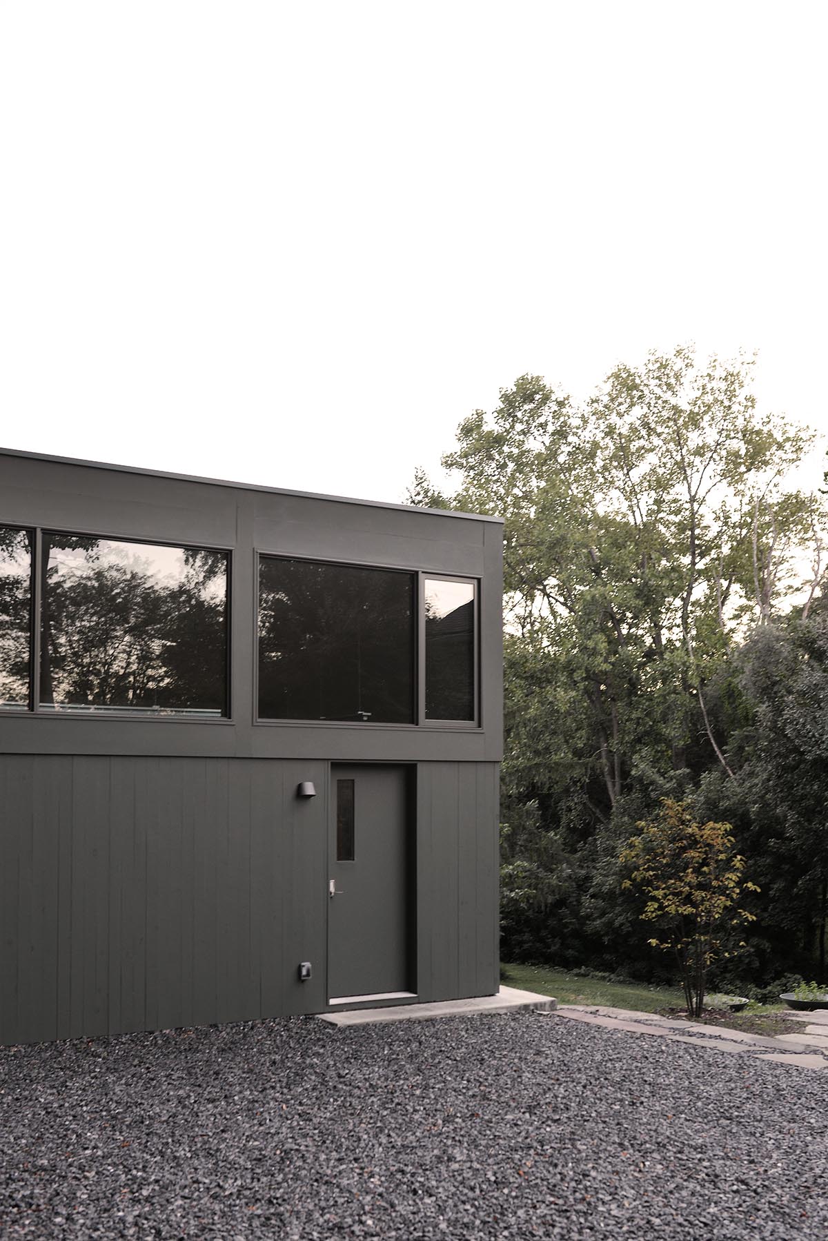 An artist's studio floats and illuminates in the landscape in Germantown