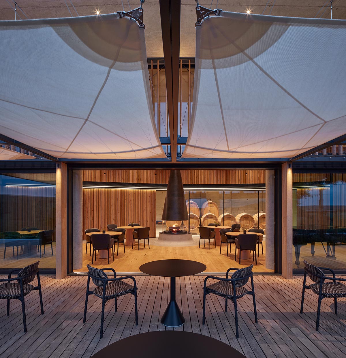 Curved green roof hides winery by Aleš Fiala in a rolling landscape in the Czech Republic