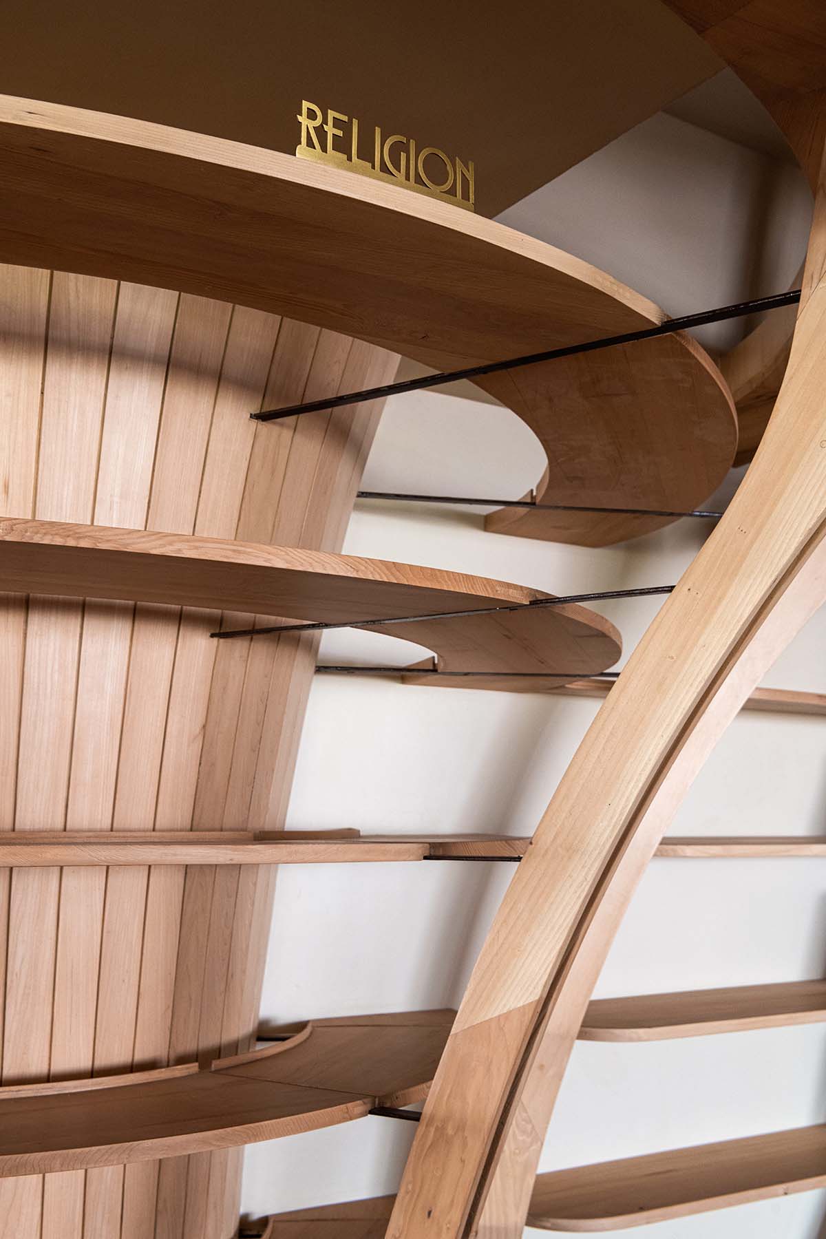 studio Hinge embeds a library under the wooden tree-like canopies in Mumbai