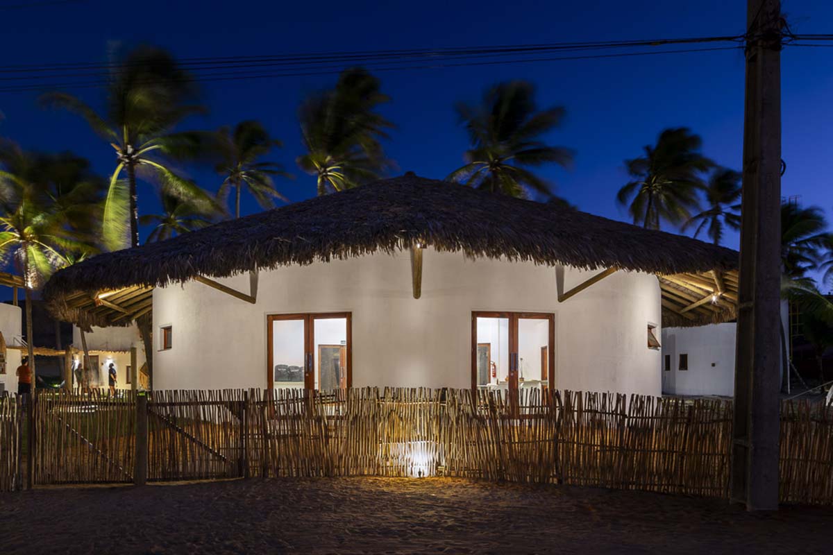 Lins Arquitetos Associados built village comprised of circular chalets overlooking coconut groves 