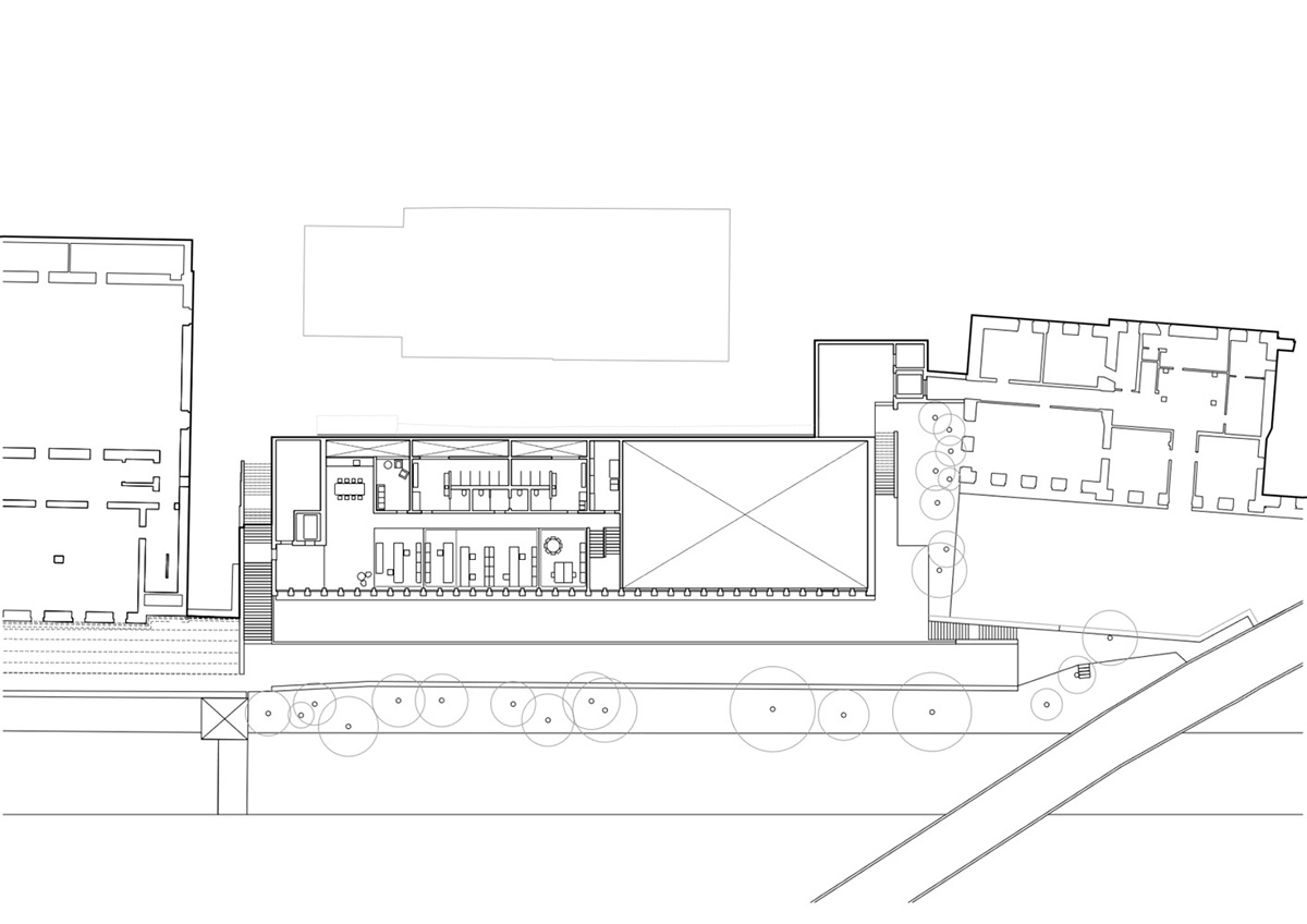 Trapezoidal openings characterize the interiors of cultural center by Estudio Barozzi Veiga in Zürich
