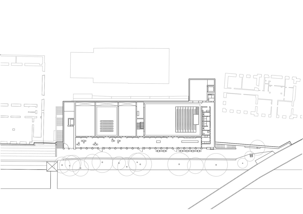 Trapezoidal openings characterize the interiors of cultural center by Estudio Barozzi Veiga in Zürich