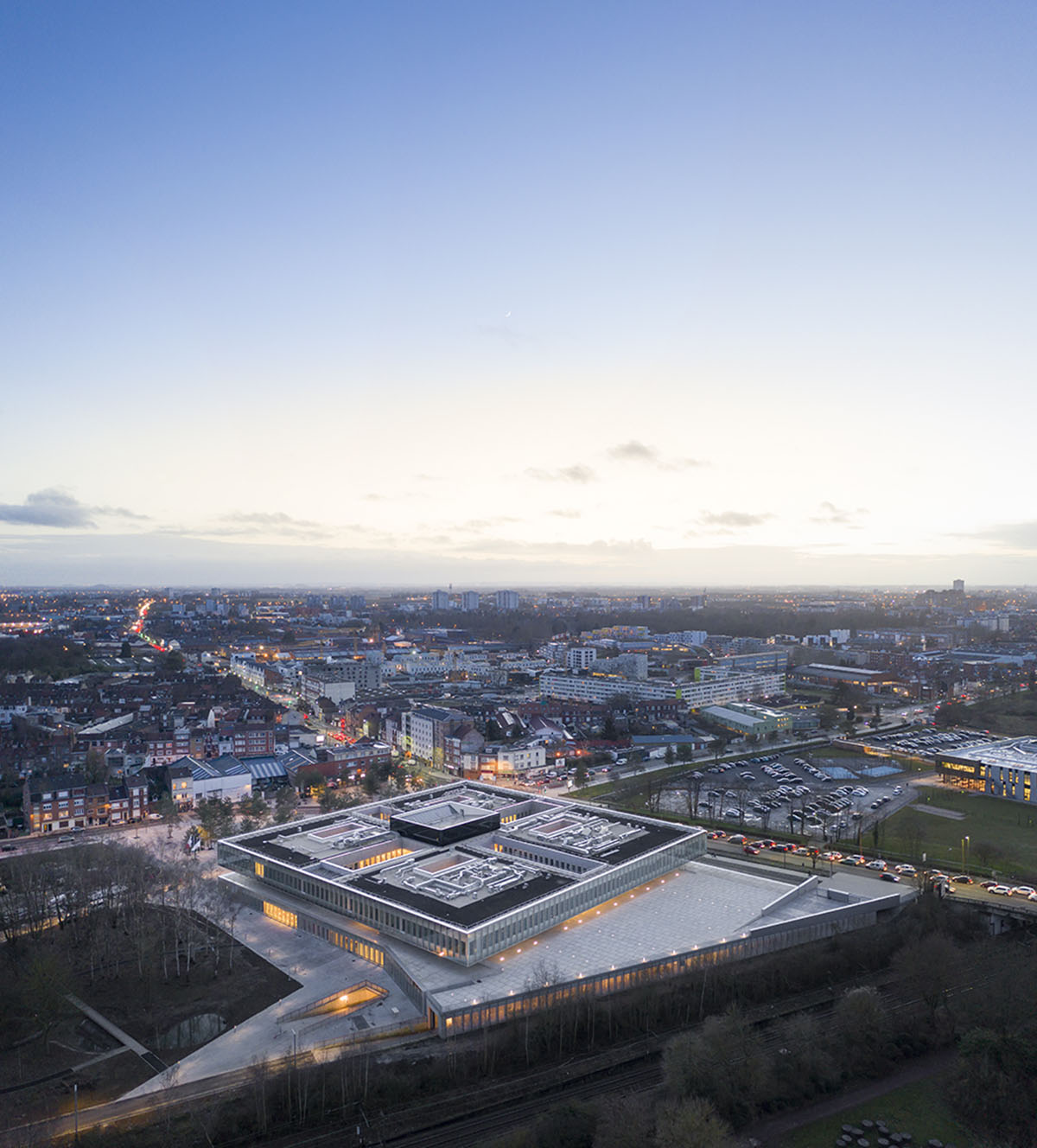 KAAN Architecten and PDAA built monolithic glazed CMA headquarters in Lille