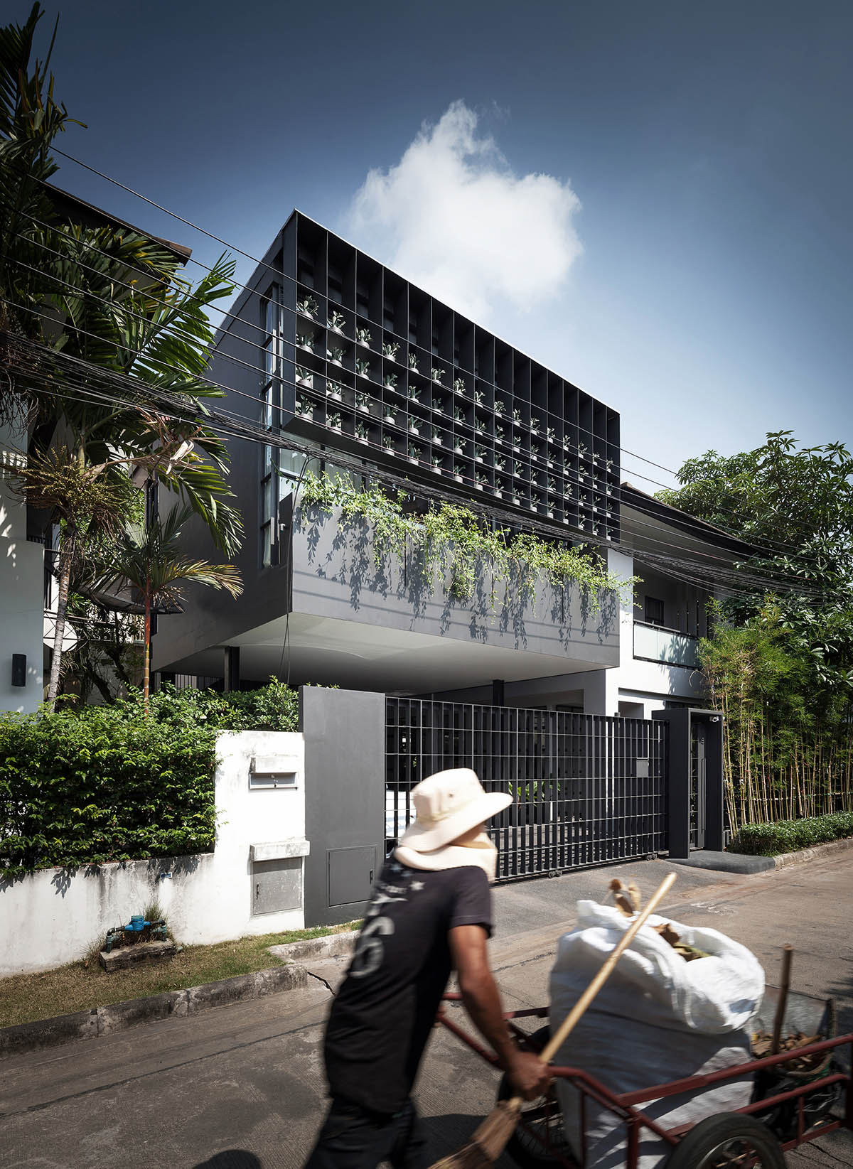 Anonym Studio renovated Bangkok’s old house with steel flower beds to create more openness