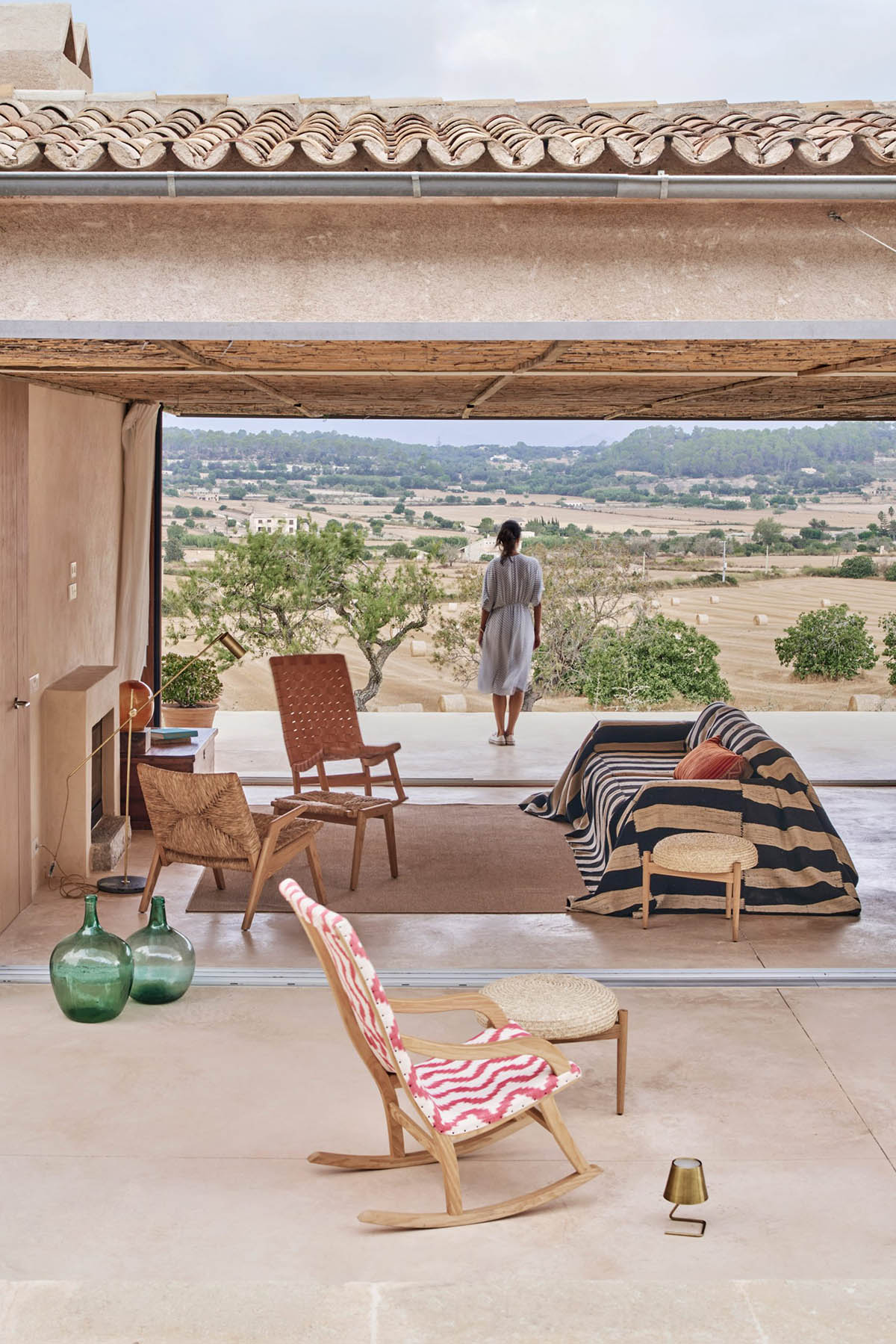 OHLAB's rural villa in Mallorca allows guests to frame natural surrounding under wattle pergola