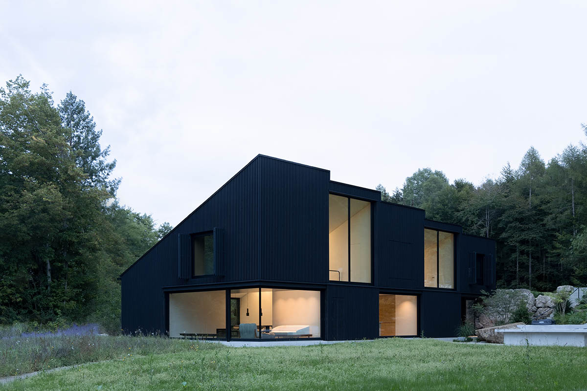 Family home by Appels Architekten plays with light and black wooden cubes in Bavaria
