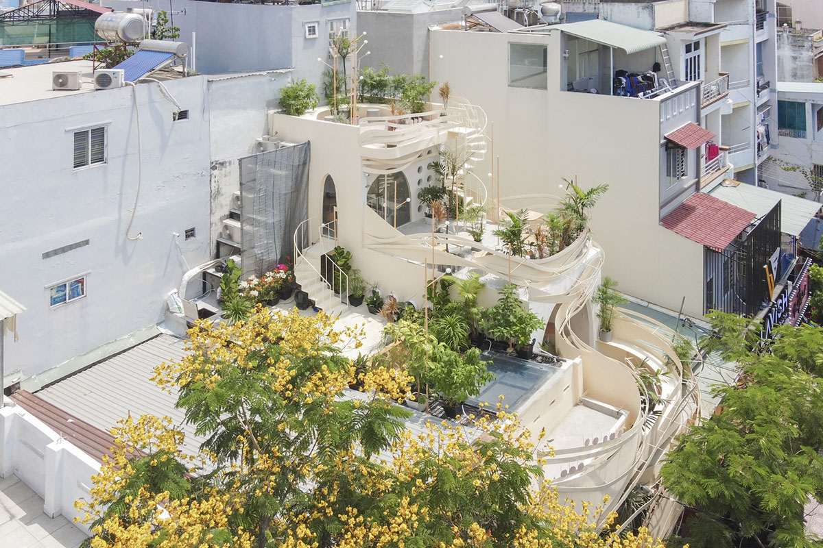 September Cafe is designed to look like a bird's nest with curved steel stripes in Vietnam