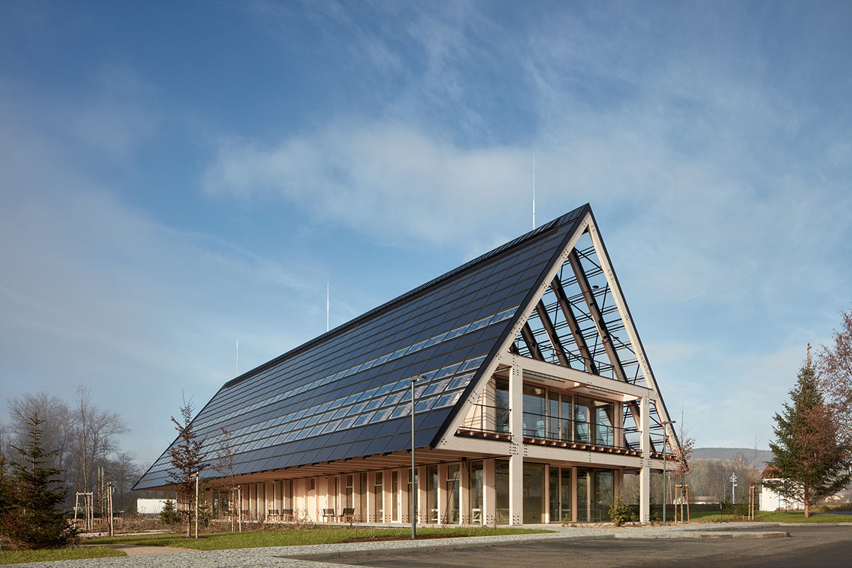 Mjölk Architekti completes gabled roof wooden headquarters addressing sustainable construction 
