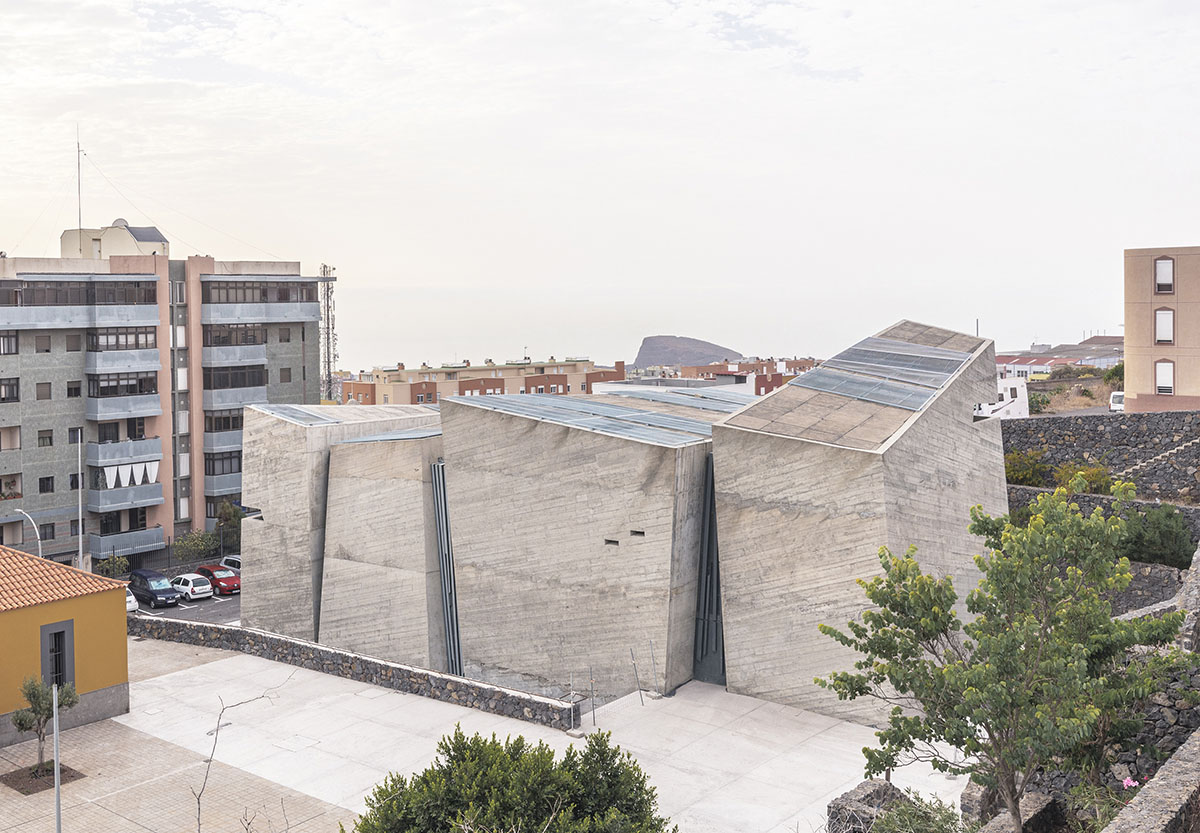 Menis Arquitectos designs church and community centre in Spain with four massive concrete volumes 