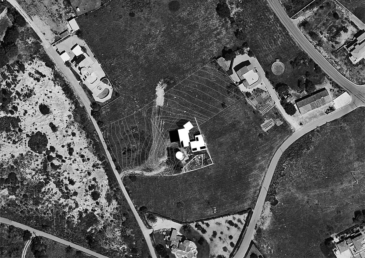 Portuguese holiday home is shaped around private patios and low-rise volumes in Algarve region