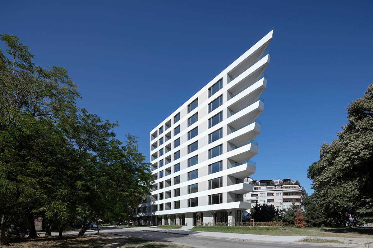 Sharp triangular balconies define this residential block designed by STARH in Bulgaria