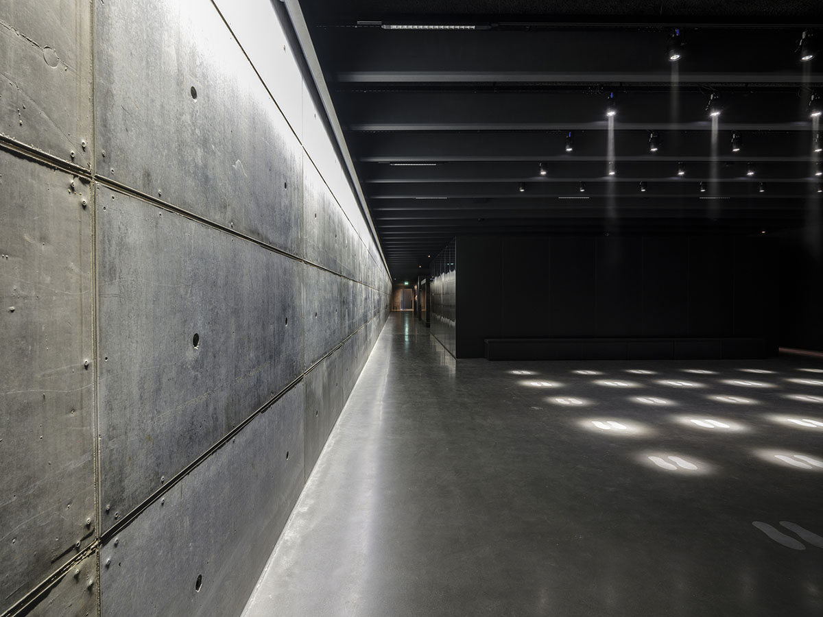 Inbo BV redesigns historic prisoner camp site with reflective pavilion and underground museum