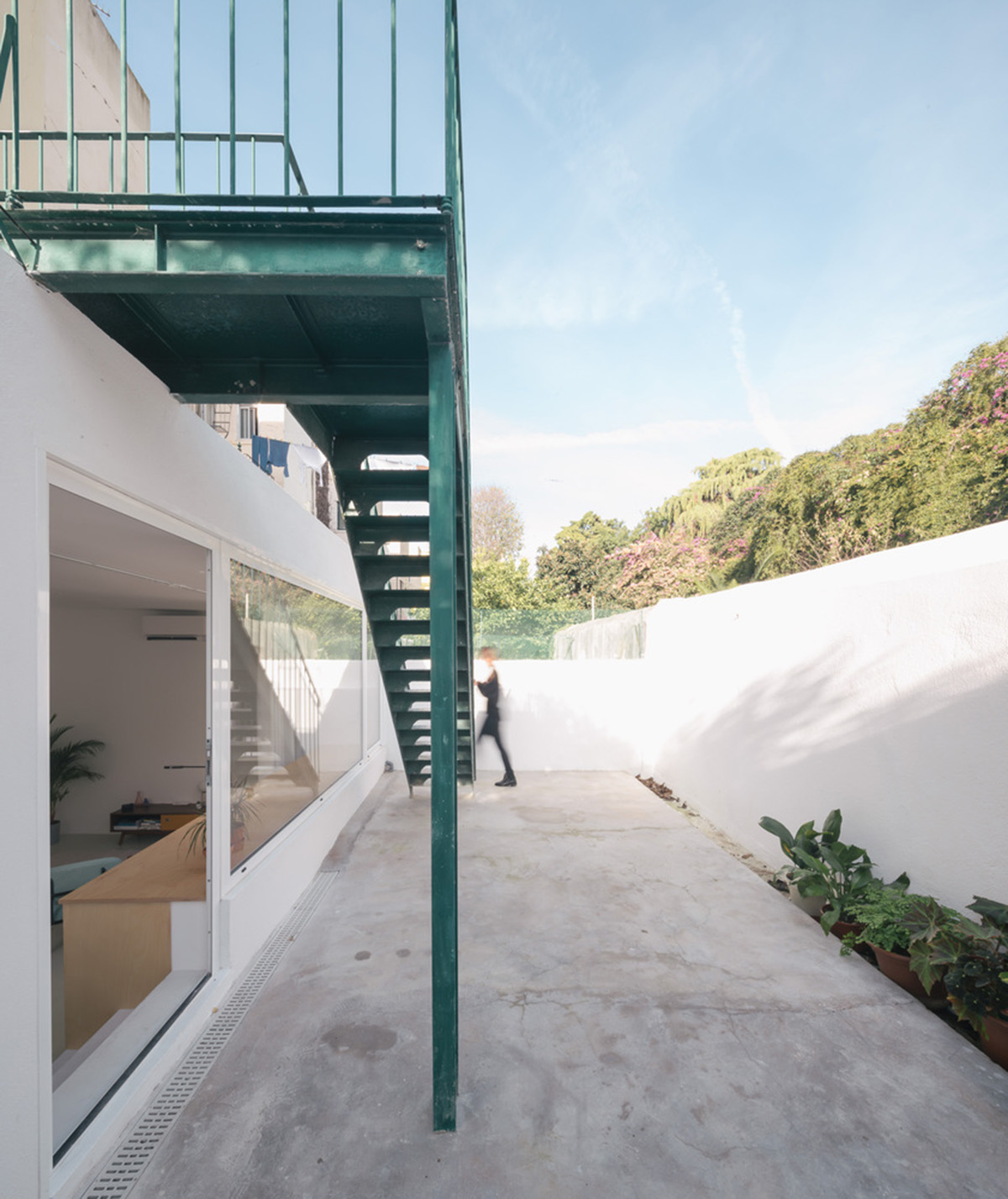 Verum Atelier redesigns old apartment with light-filled and airy interior space in Lisbon, Portugal